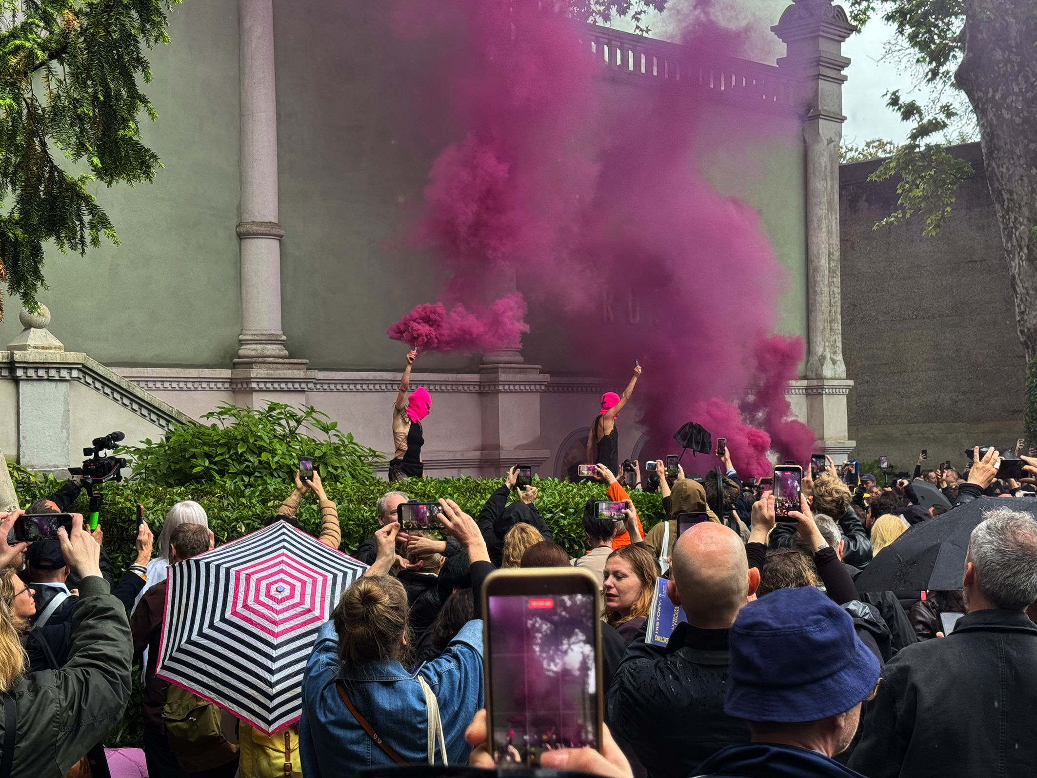 Activist group Pussy Riot protest outside the Russian Pavilion.