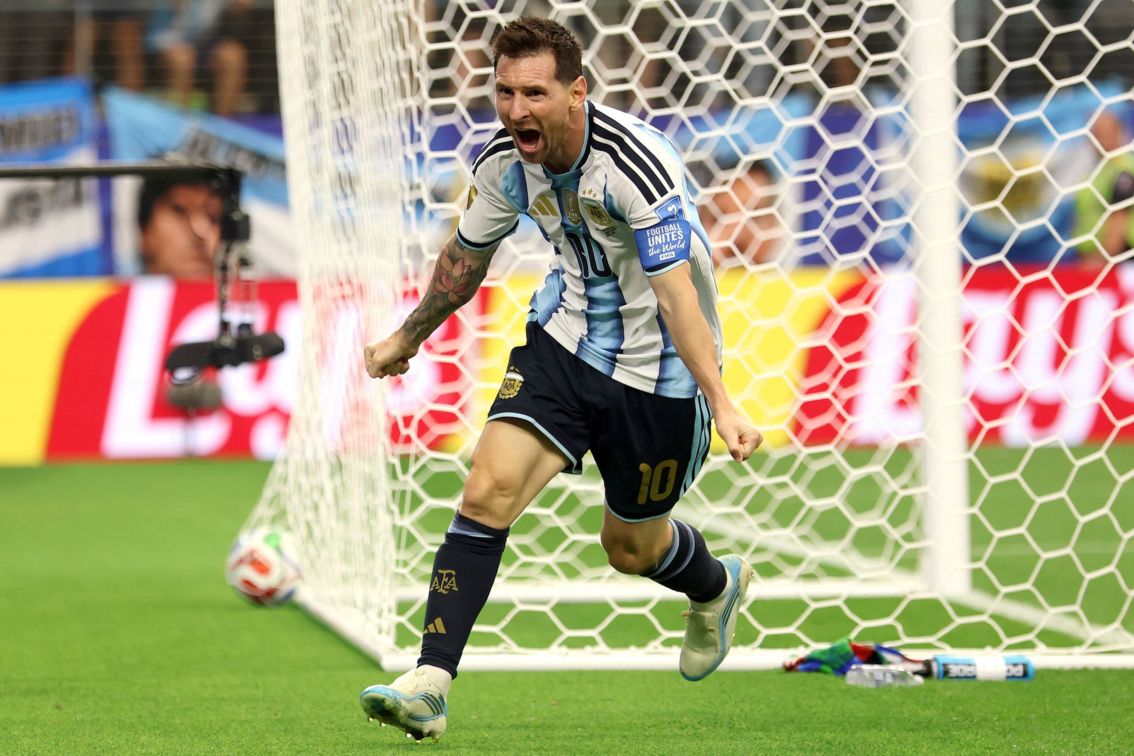Argentina’s Lionel Messi celebrating on the pitch.
