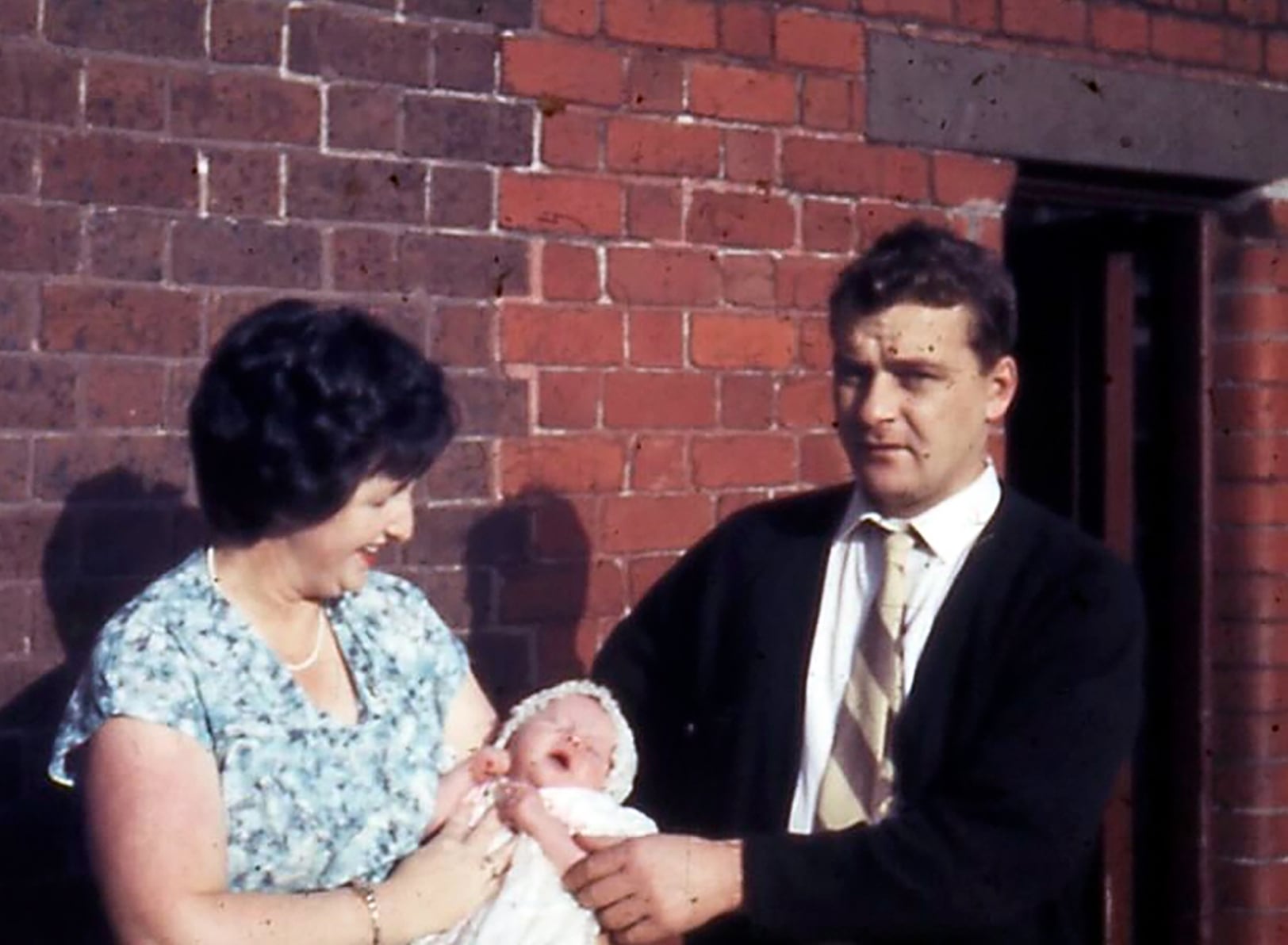 The author as a baby pictured with her mum and dad in Richmond.