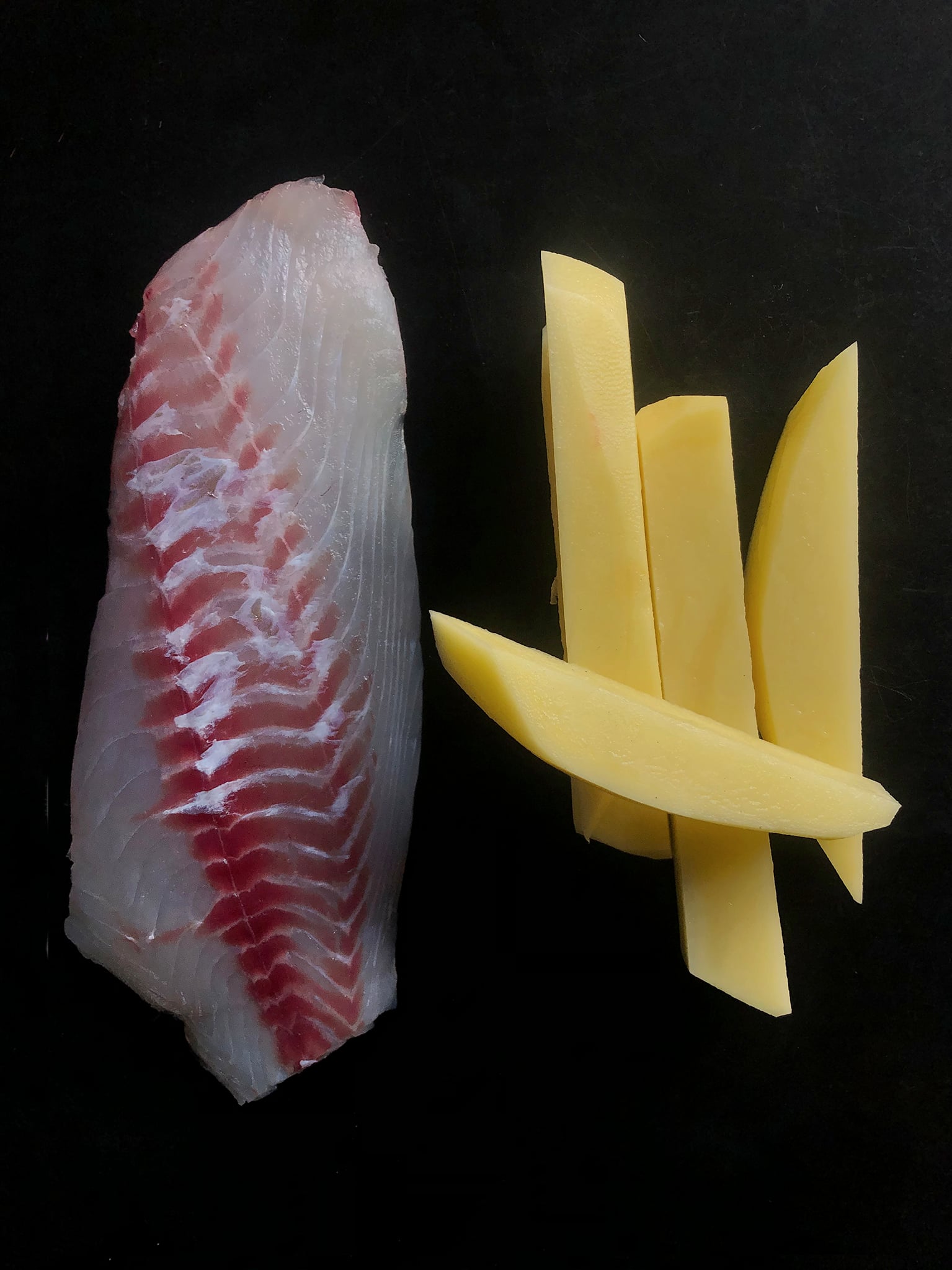 Raw fillet of fish.