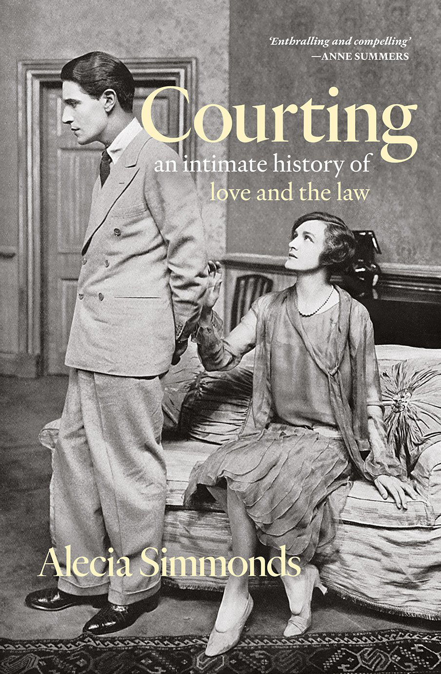 Book cover: black & white photograph of a woman sitting on a couch. Her hand is reached out to a man with his back turned to her.