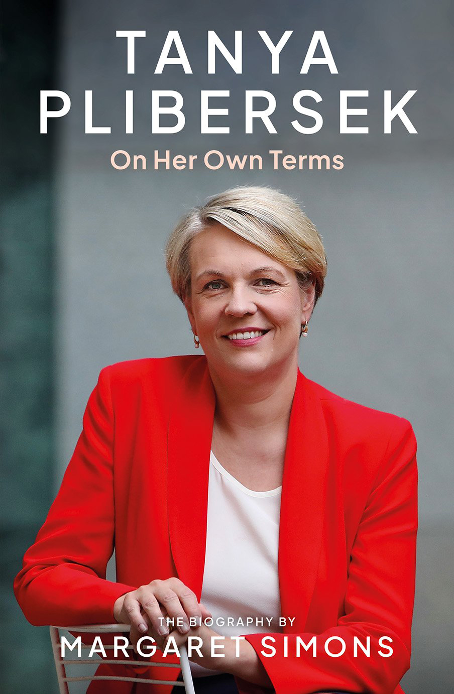 Portrait image of Tanya Plibersek in a white shirt and a red blazer.