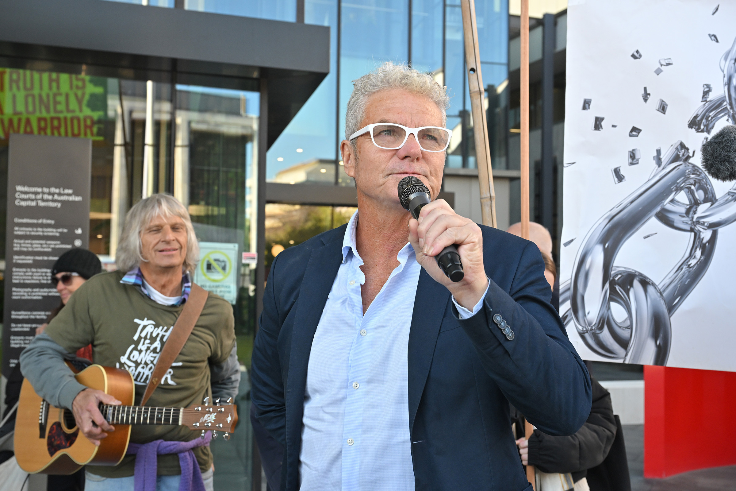 David McBride with a microphone outside the Supreme Court.