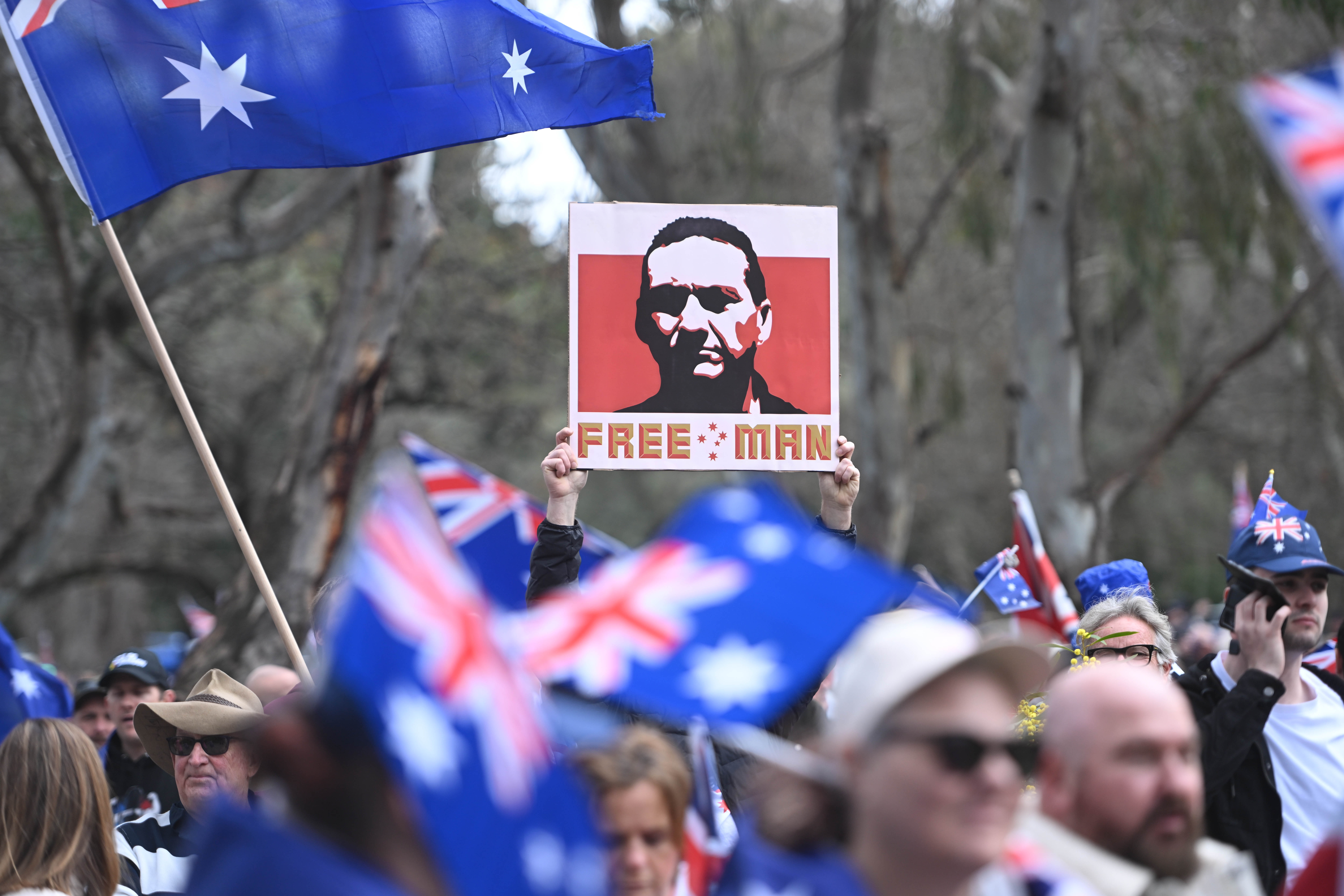 A placard of Dezi Freeman on display at a rally.