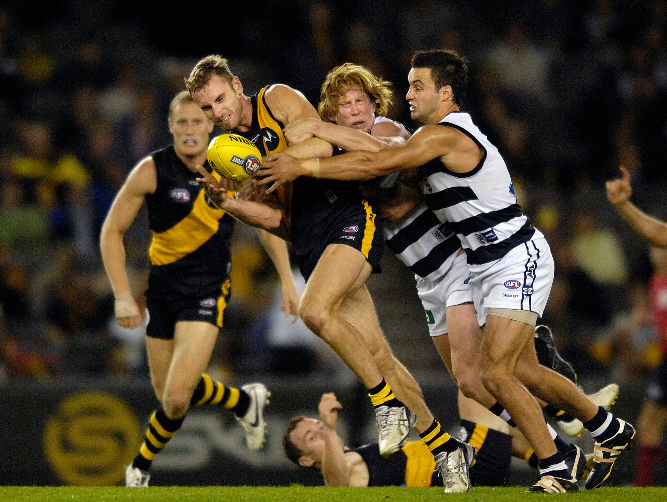 Richmond’s Shane Tuck is tackled during an AFL match in 2007. 