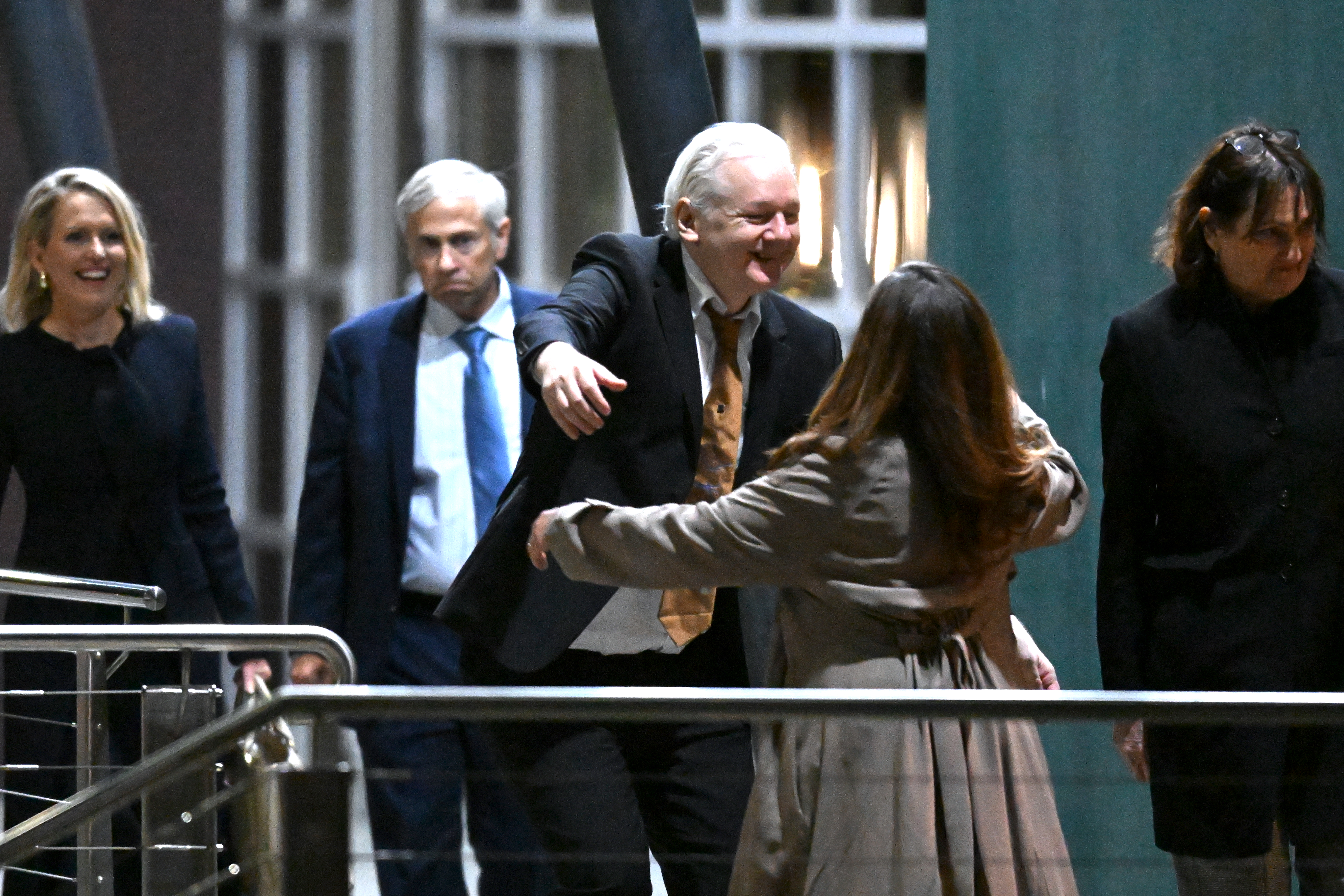WikiLeaks founder Julian Assange hugs his wife, Stella Assange, after arriving at Canberra Airport on Wednesday.