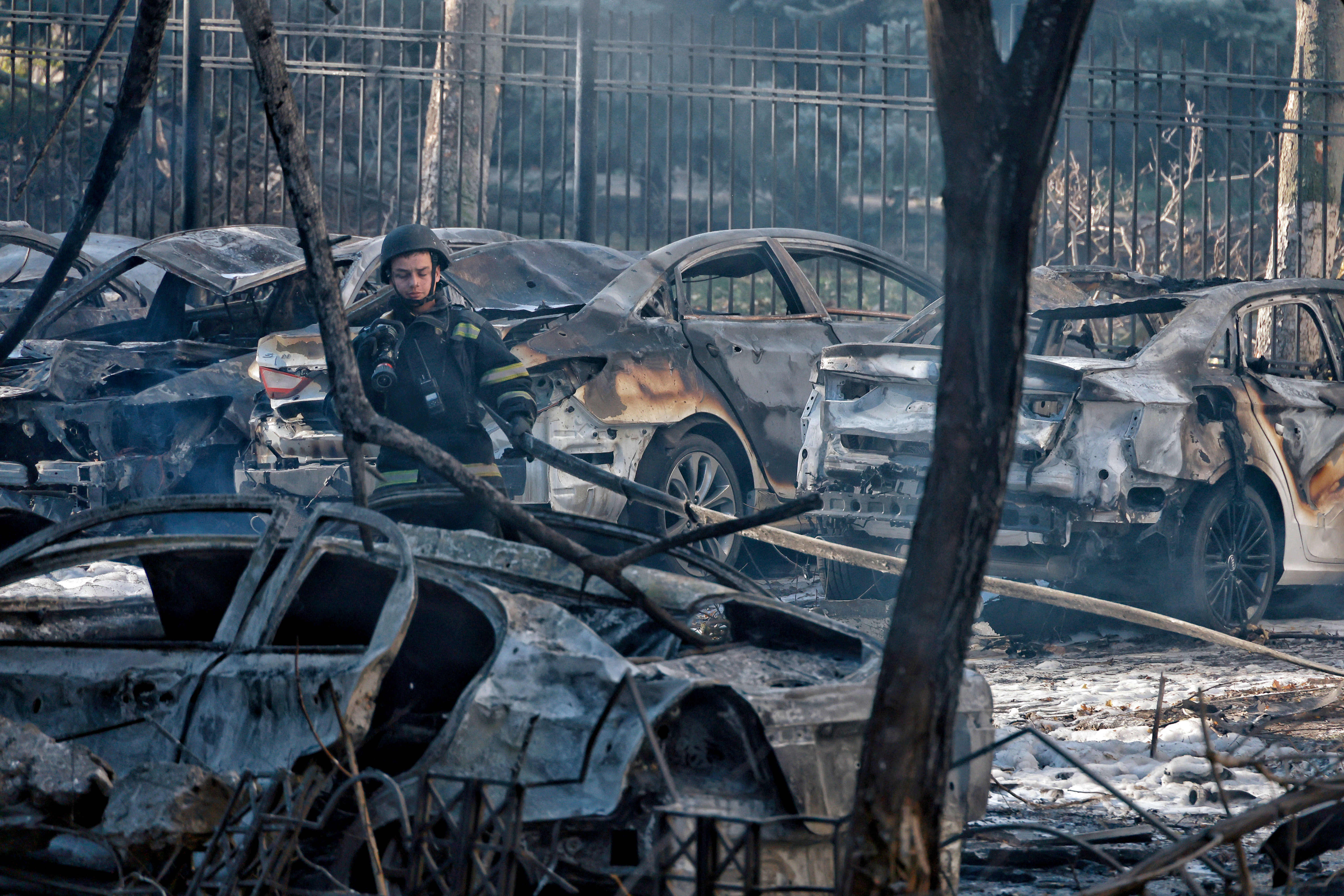 A rescuer surveys the damage by Russian rocket fire in Odesa, Ukraine. 