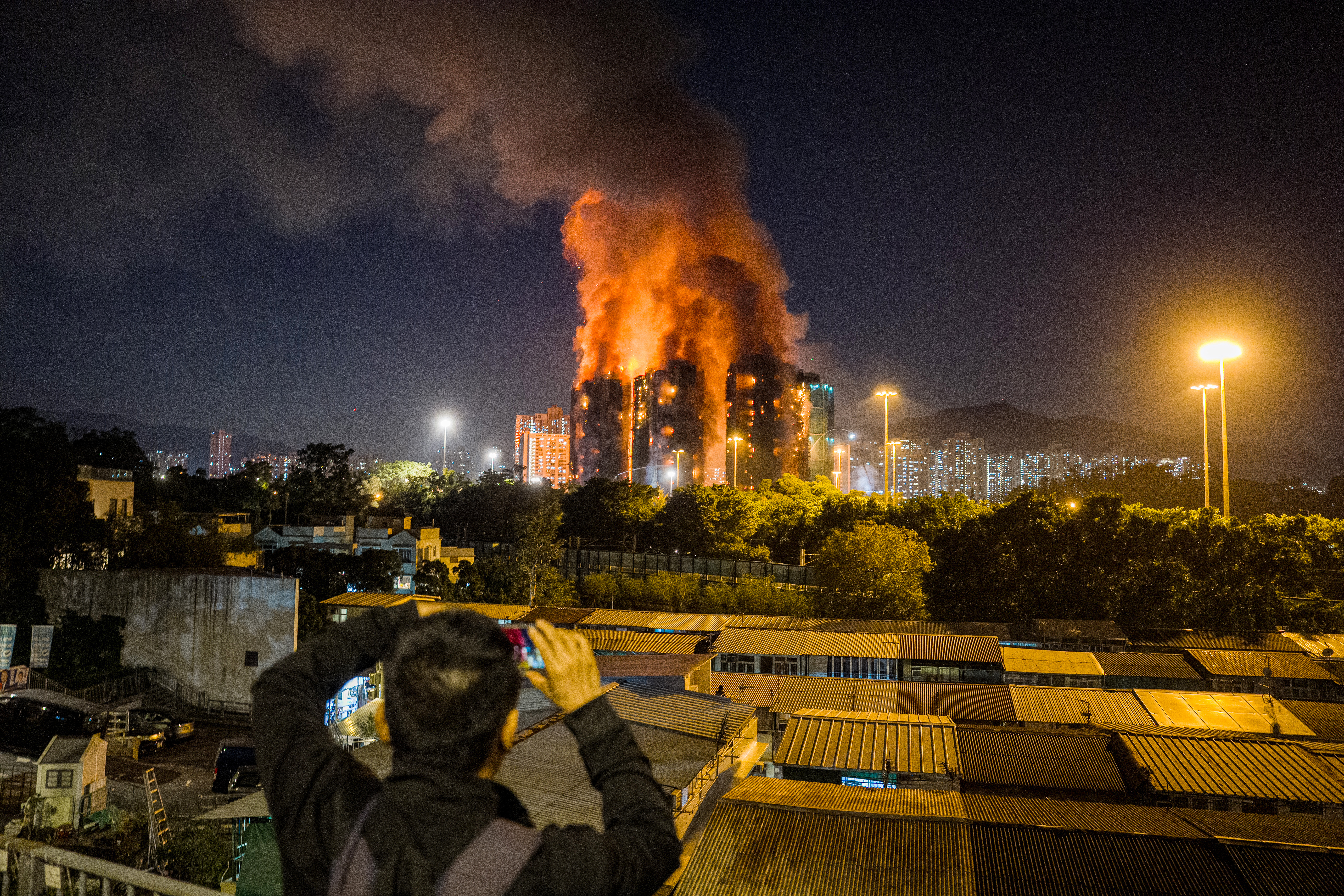 Frantic hunt for survivors as Hong Kong towers burn