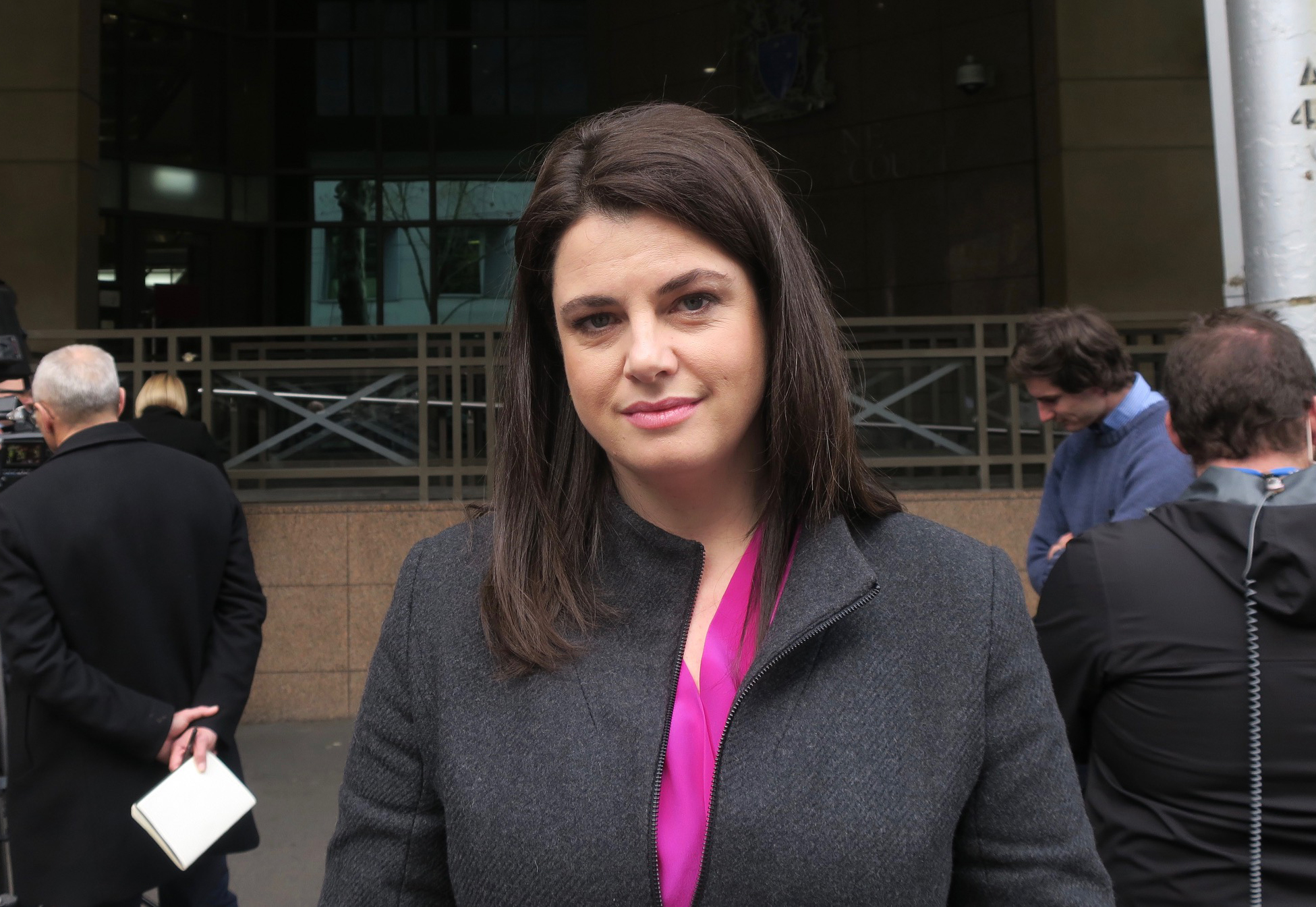 A portrait photograph of a woman with black hair.