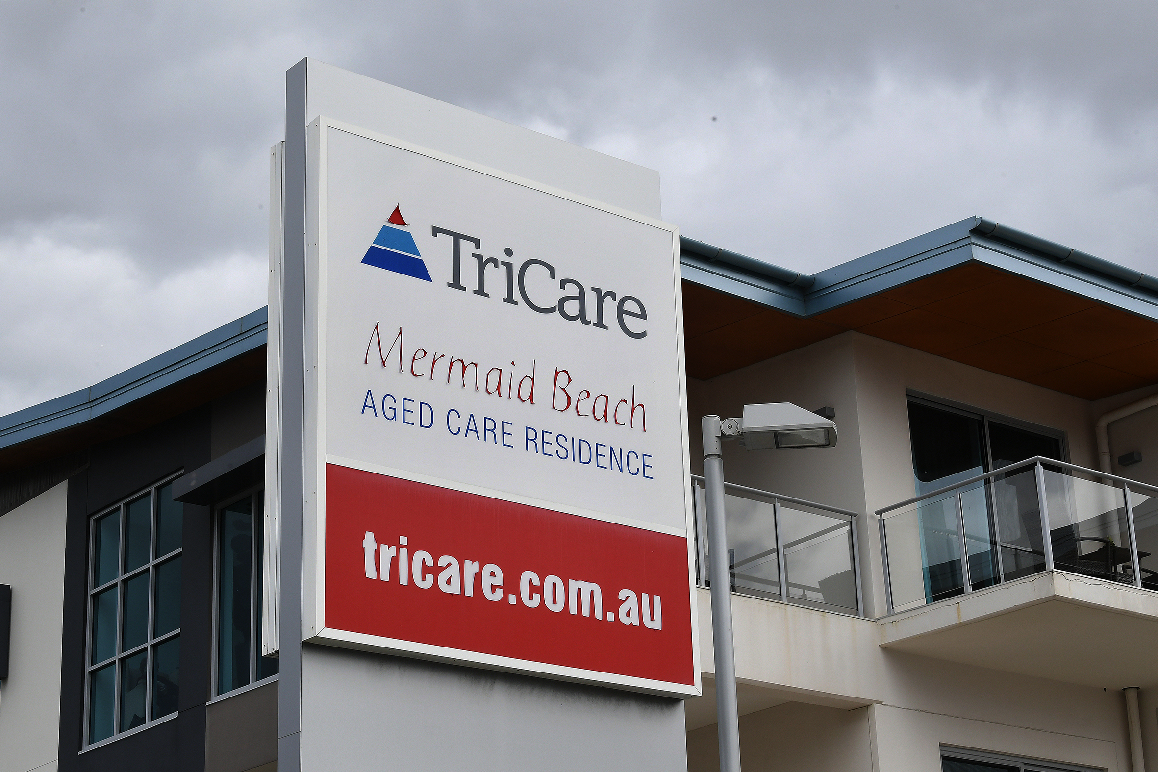 A building with a Tri-Care sign beside it.