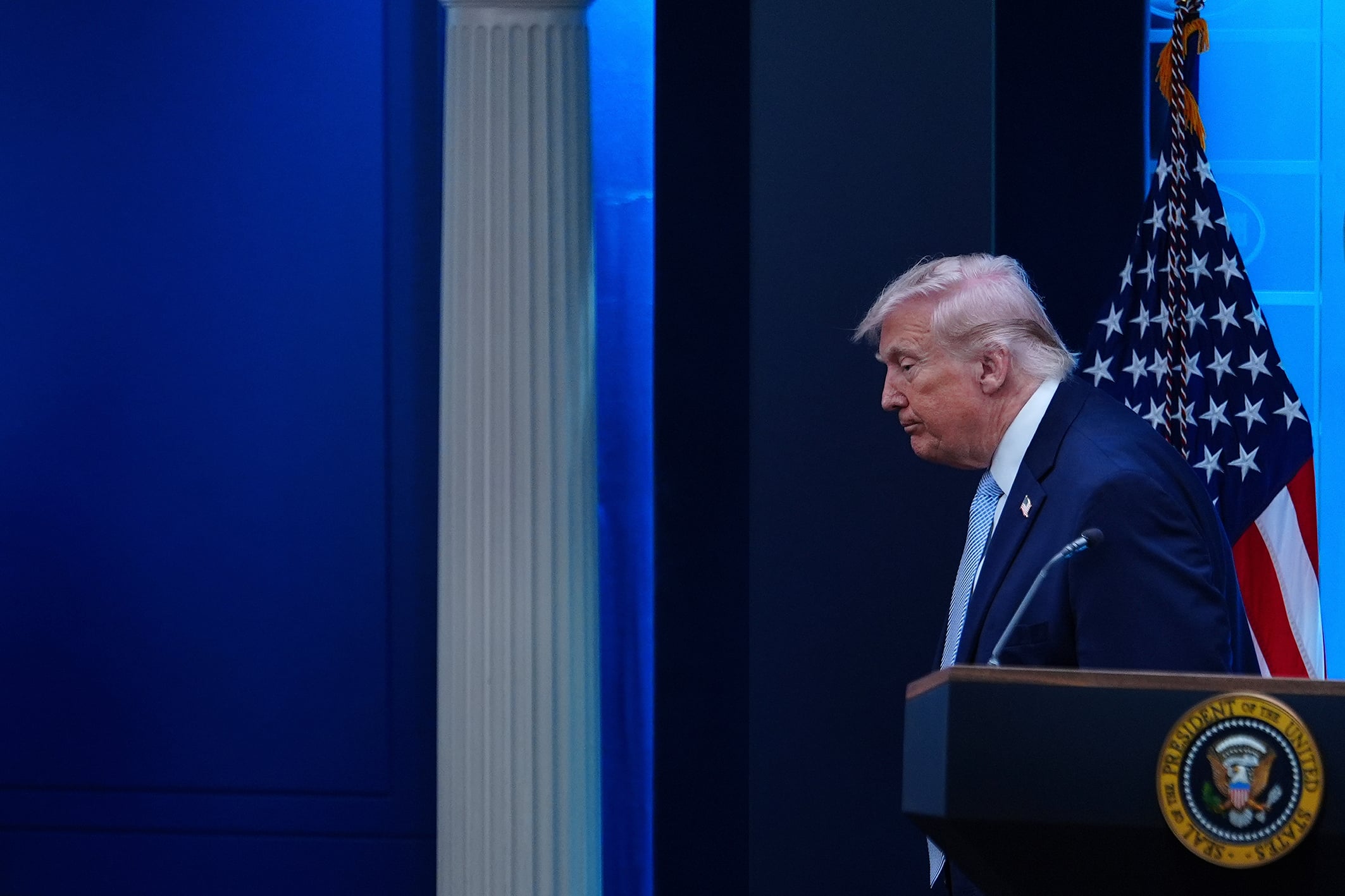 President Donald Trump leaves the White House’s press briefing room.