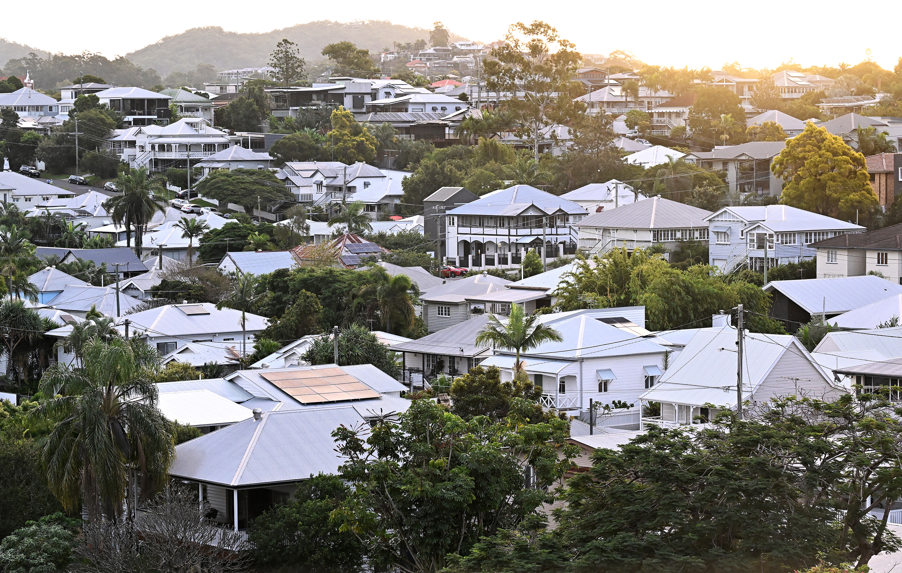 A suburban neighbourhood under a sunset.