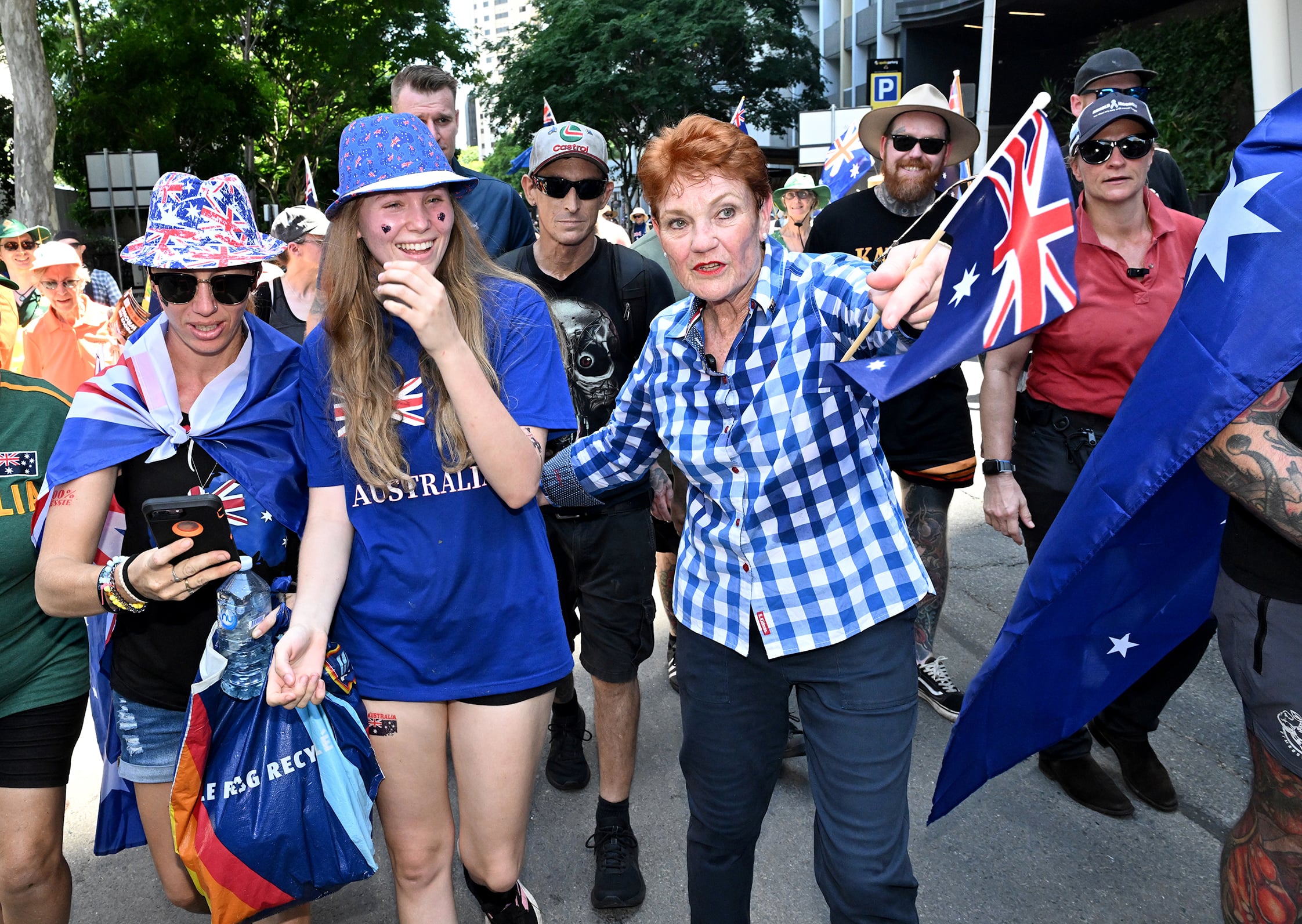 Pauline Hanson walks with protestors at a March for Australia rally.
