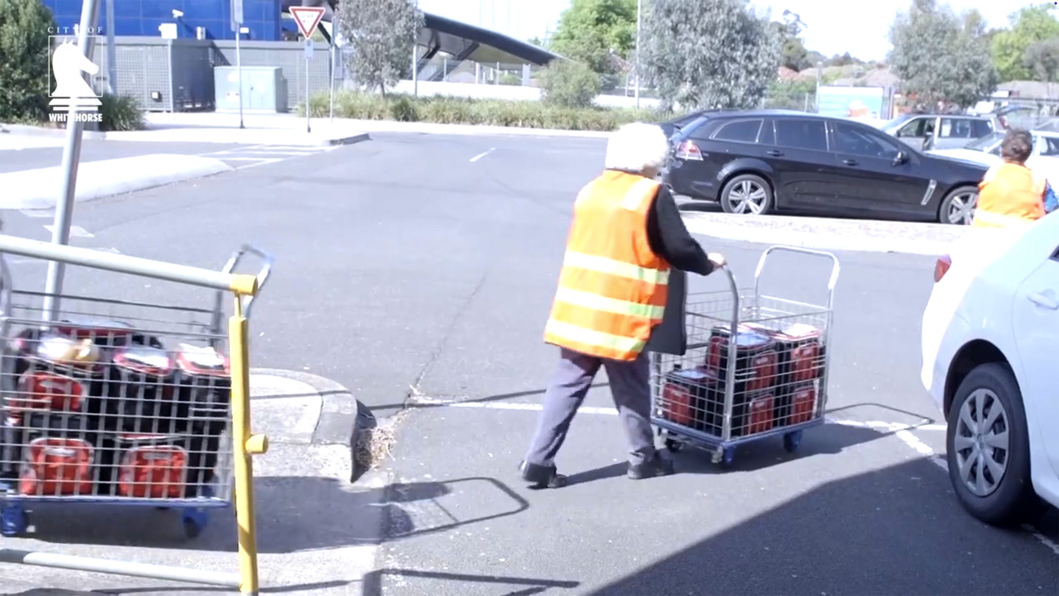 A Meals on Wheels worker delivers food.