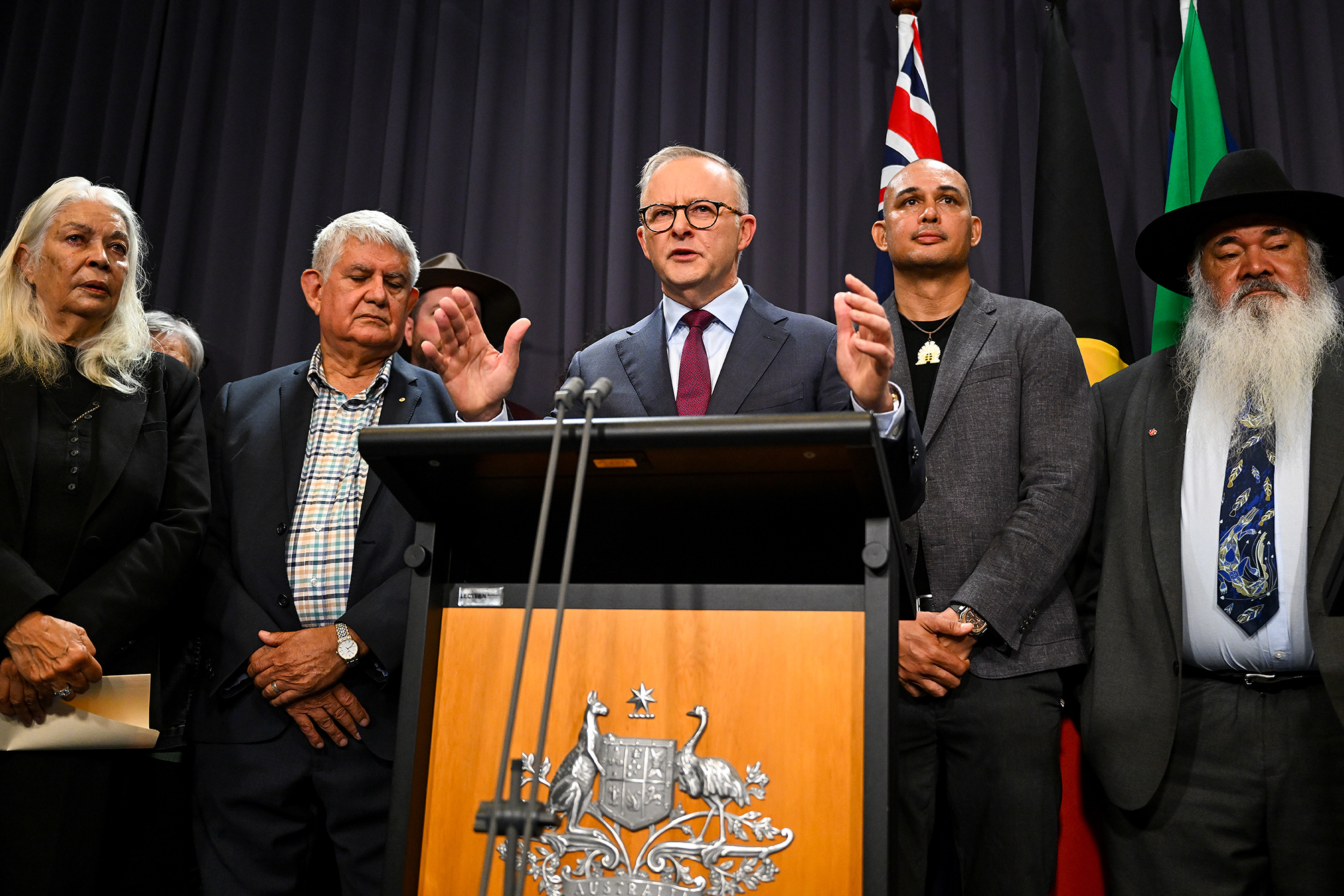 Prime Minister Anthony Albanese flanked by members of the referendum working group.