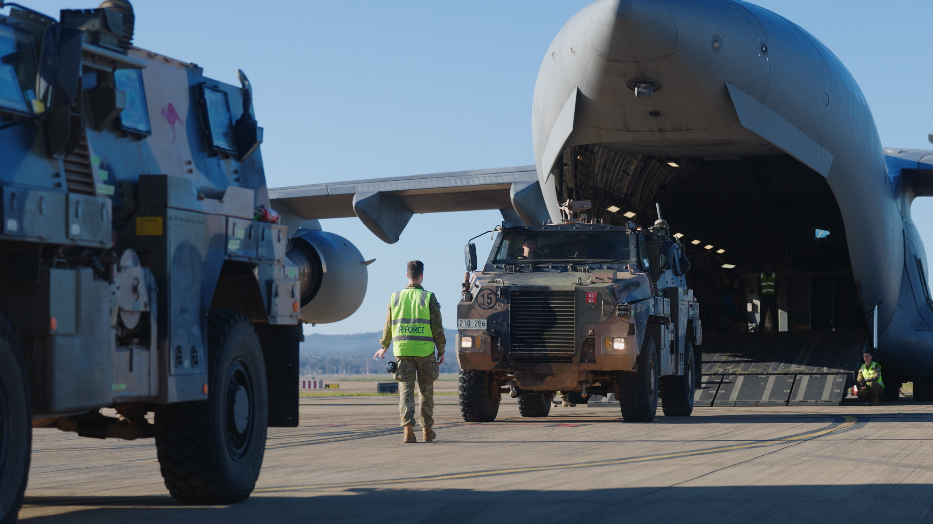 A Bushmaster being loaded onto an ADF aircraft.