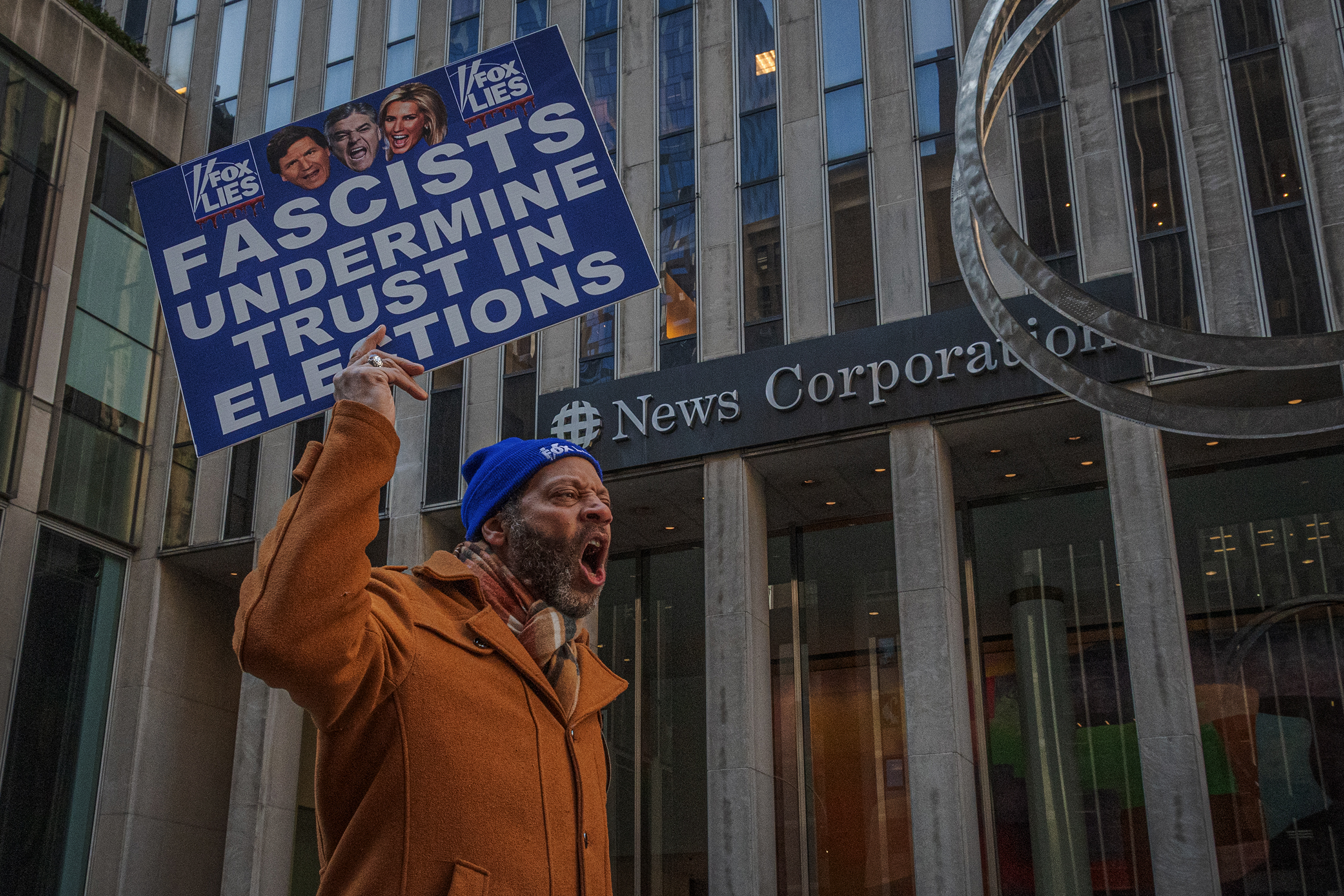 An activist protests outside Fox News headquarters last month.