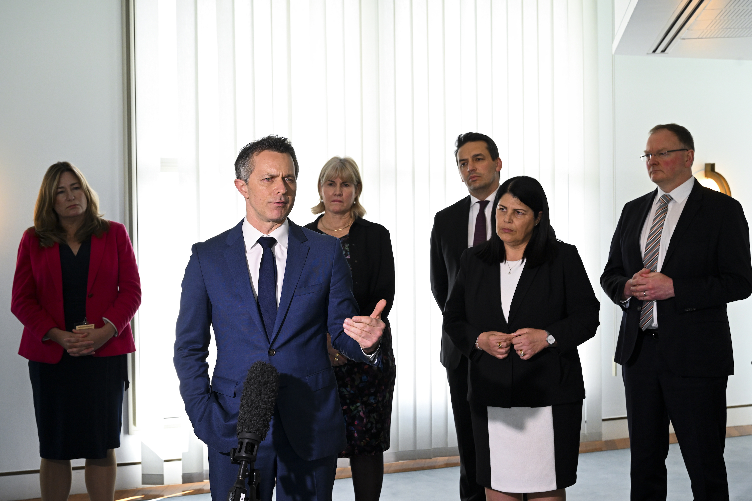 The federal Education minister, Jason Clare, flanked by state and territory counterparts. 
