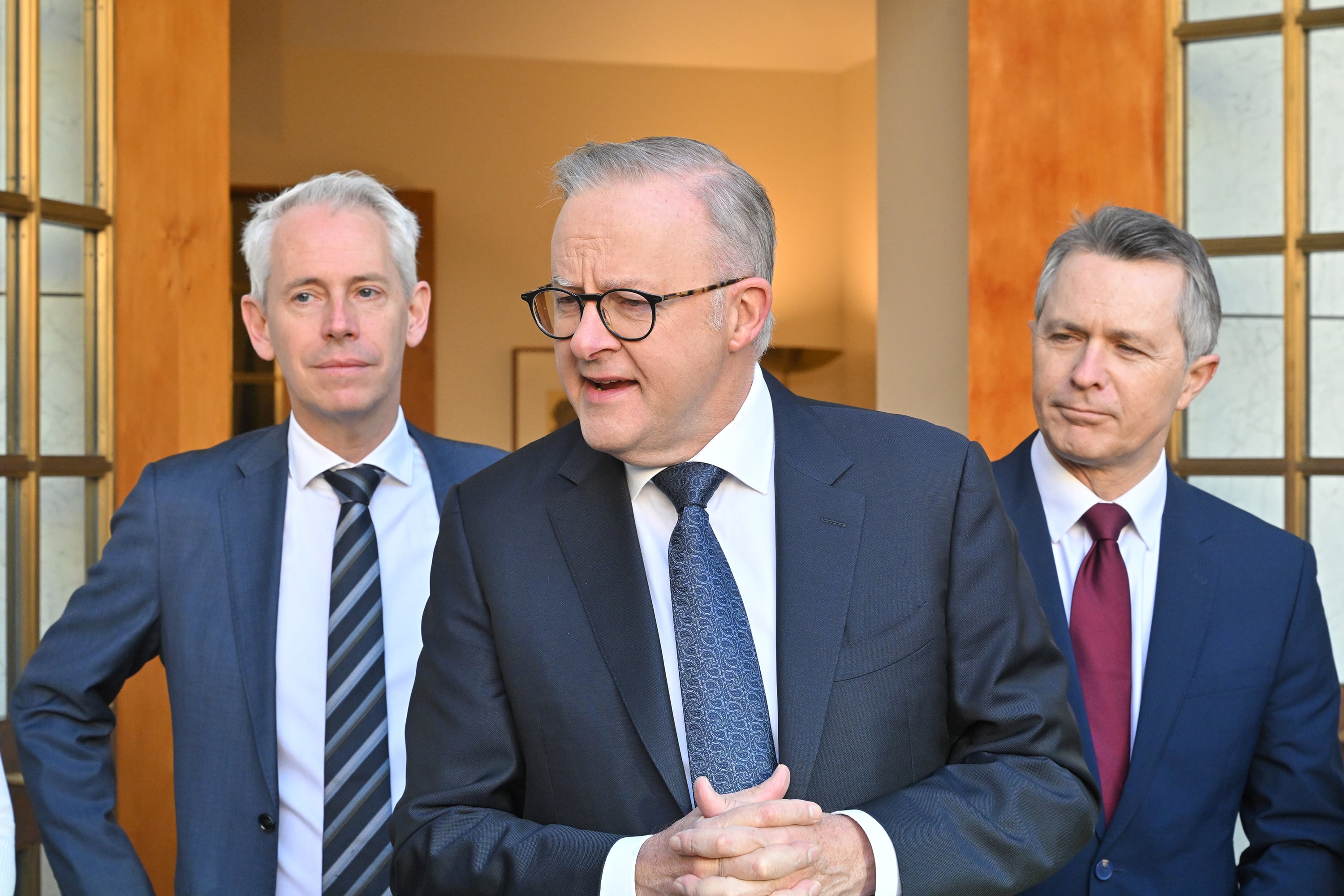Andrew Giles, Anthony Albanese and Jason Clare at a press conference.