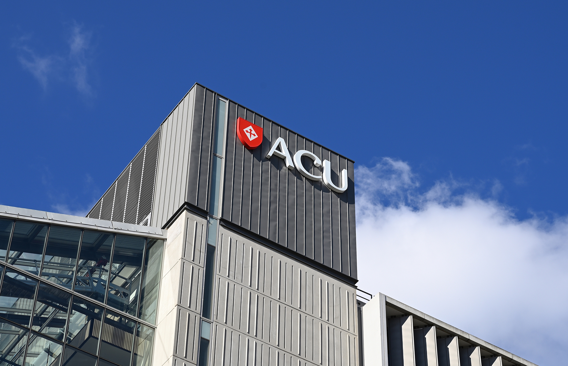 An ACU campus building under a blue sky.