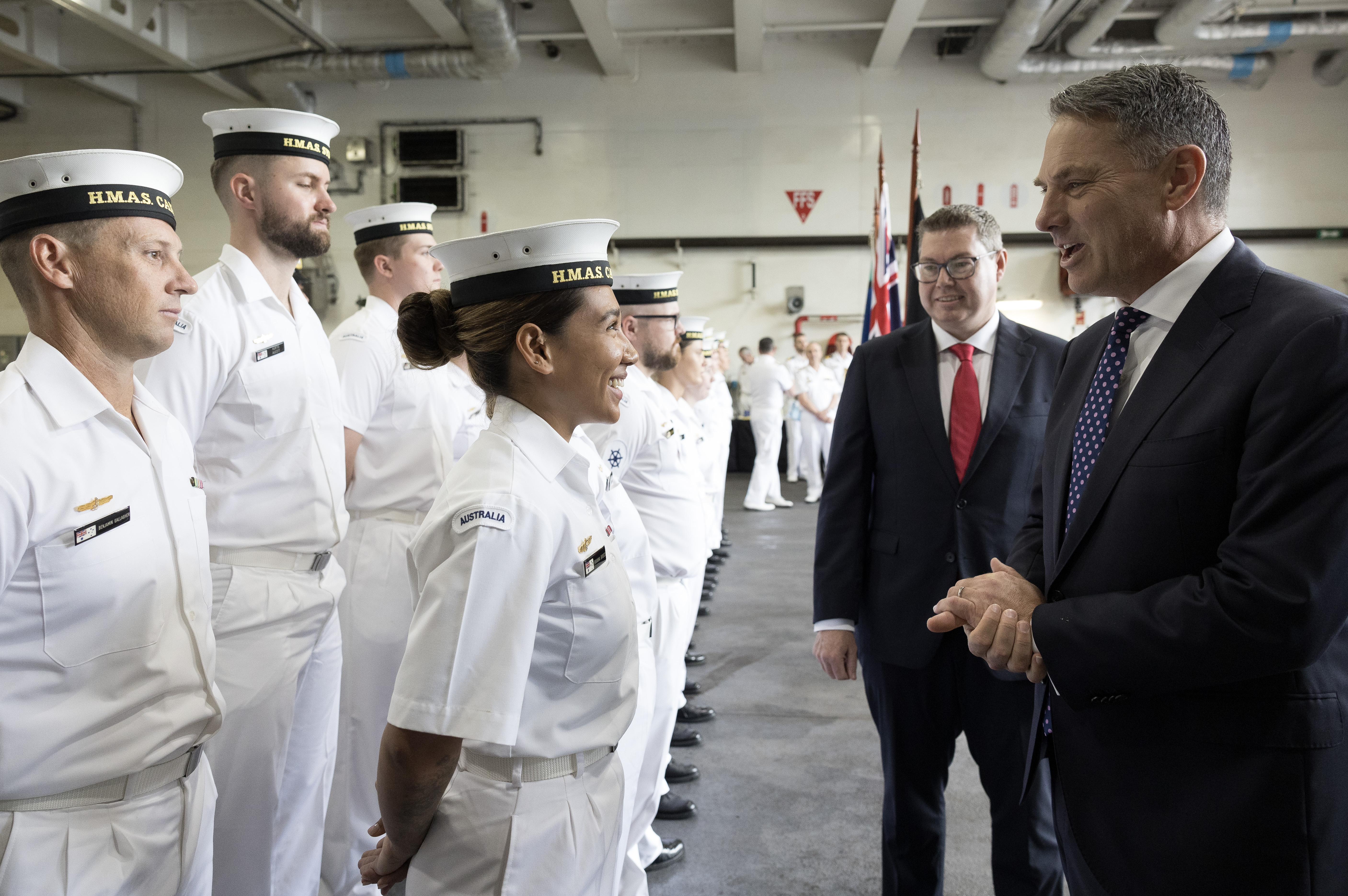 Defence Minister Richard Marles with sailors on HMAS Canberra at Fleet Base East, Sydney. 