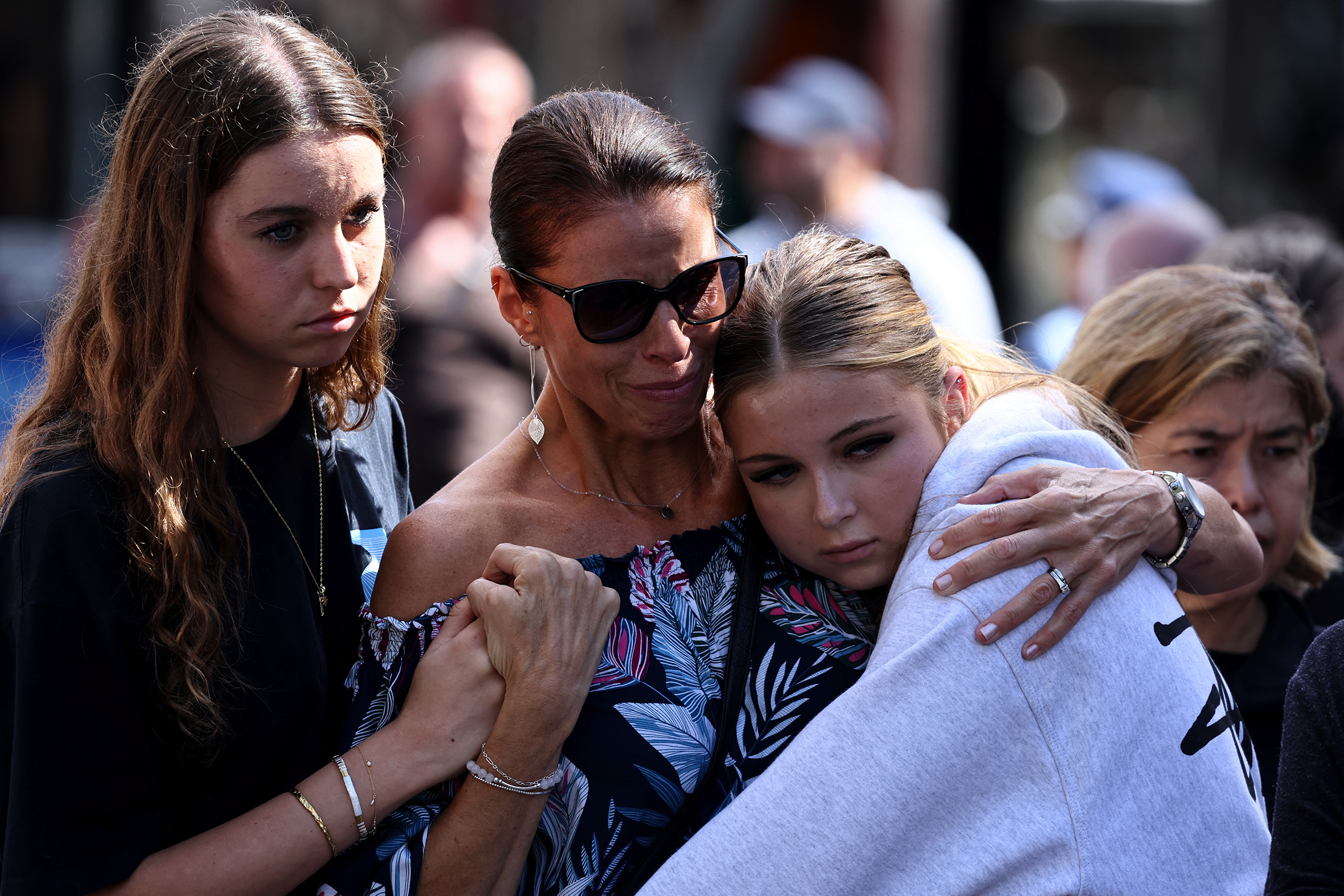 Mourners gather outside Westfield Bondi Junction.
