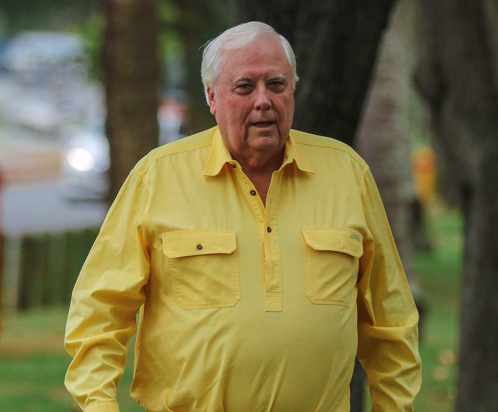 Clive Palmer wearing a yellow shirt.