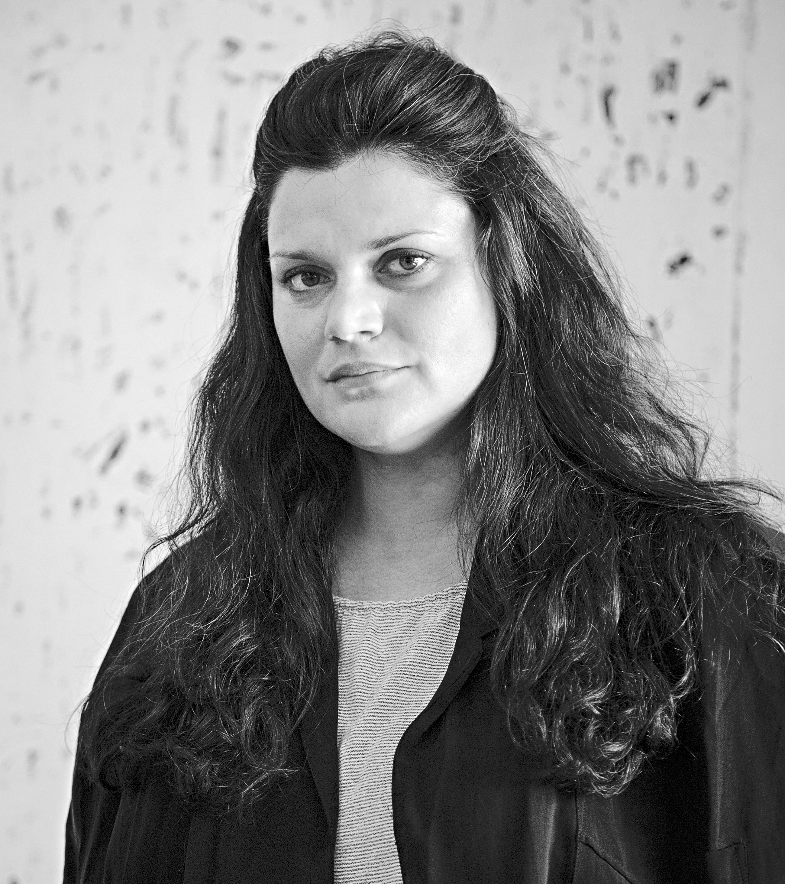 Portrait photograph of a woman with dark hair.