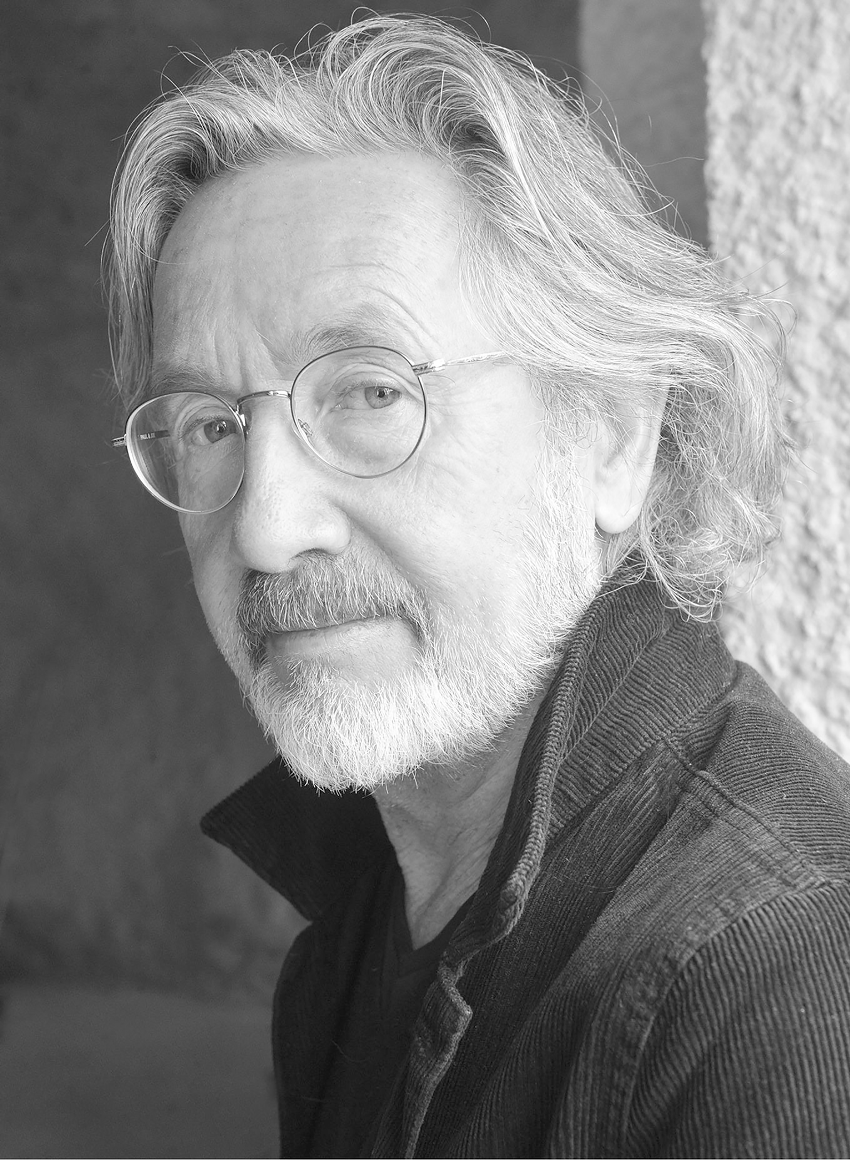 Photograph of Martin Provost wearing glasses and grey beard.