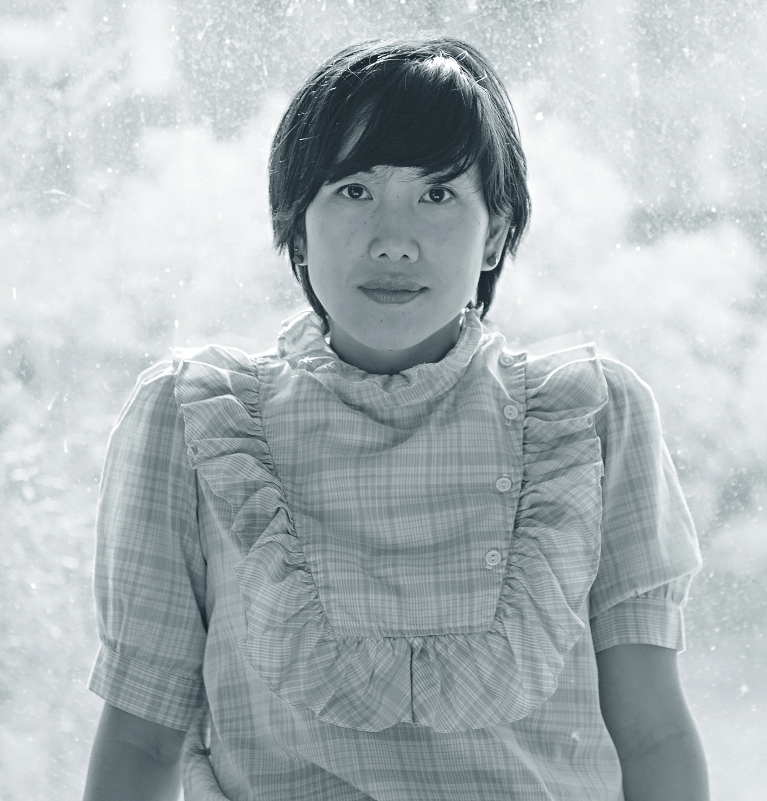 Black & white portrait photograph of a woman with short hair.