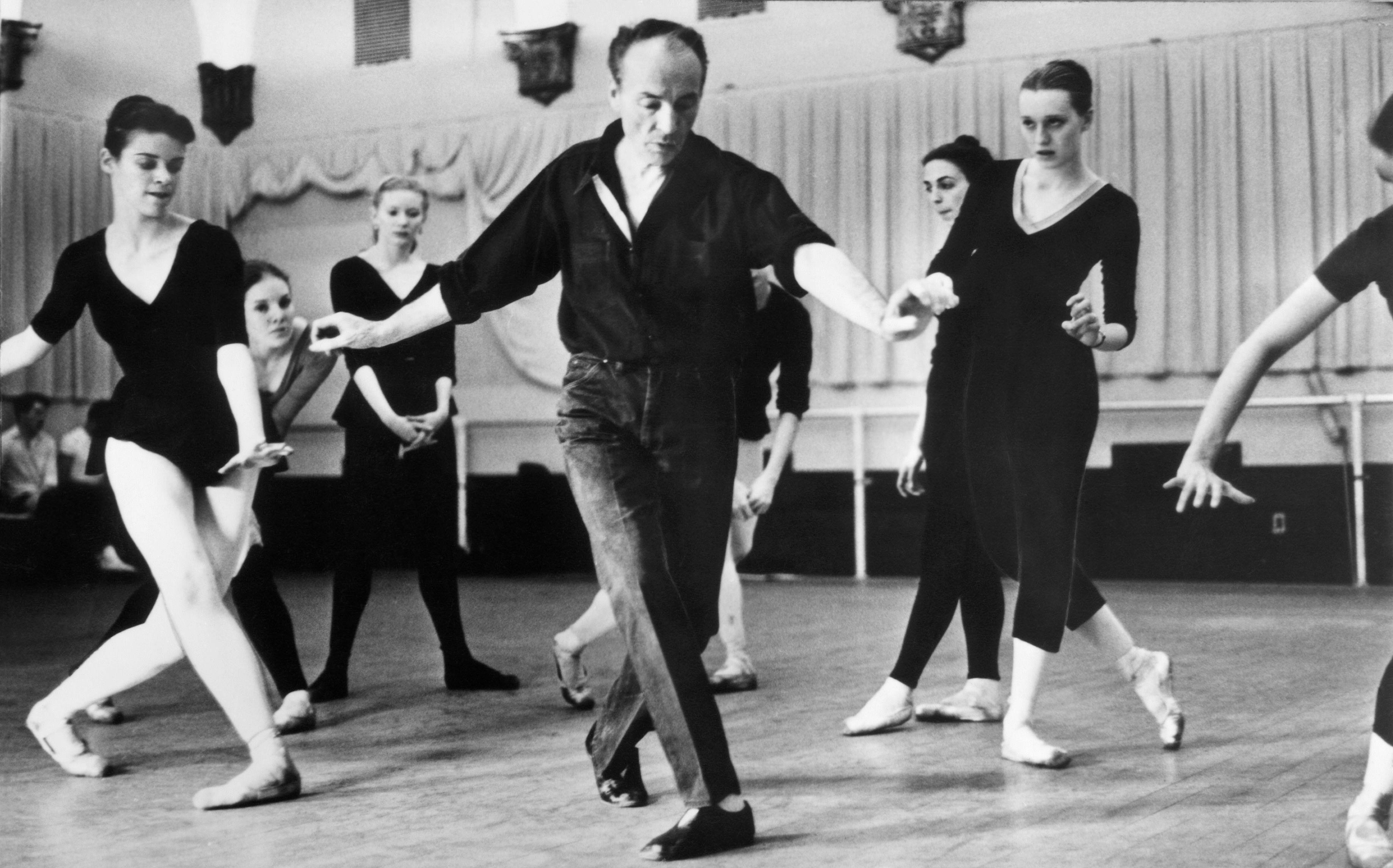 Dancers practicing in a studio.
