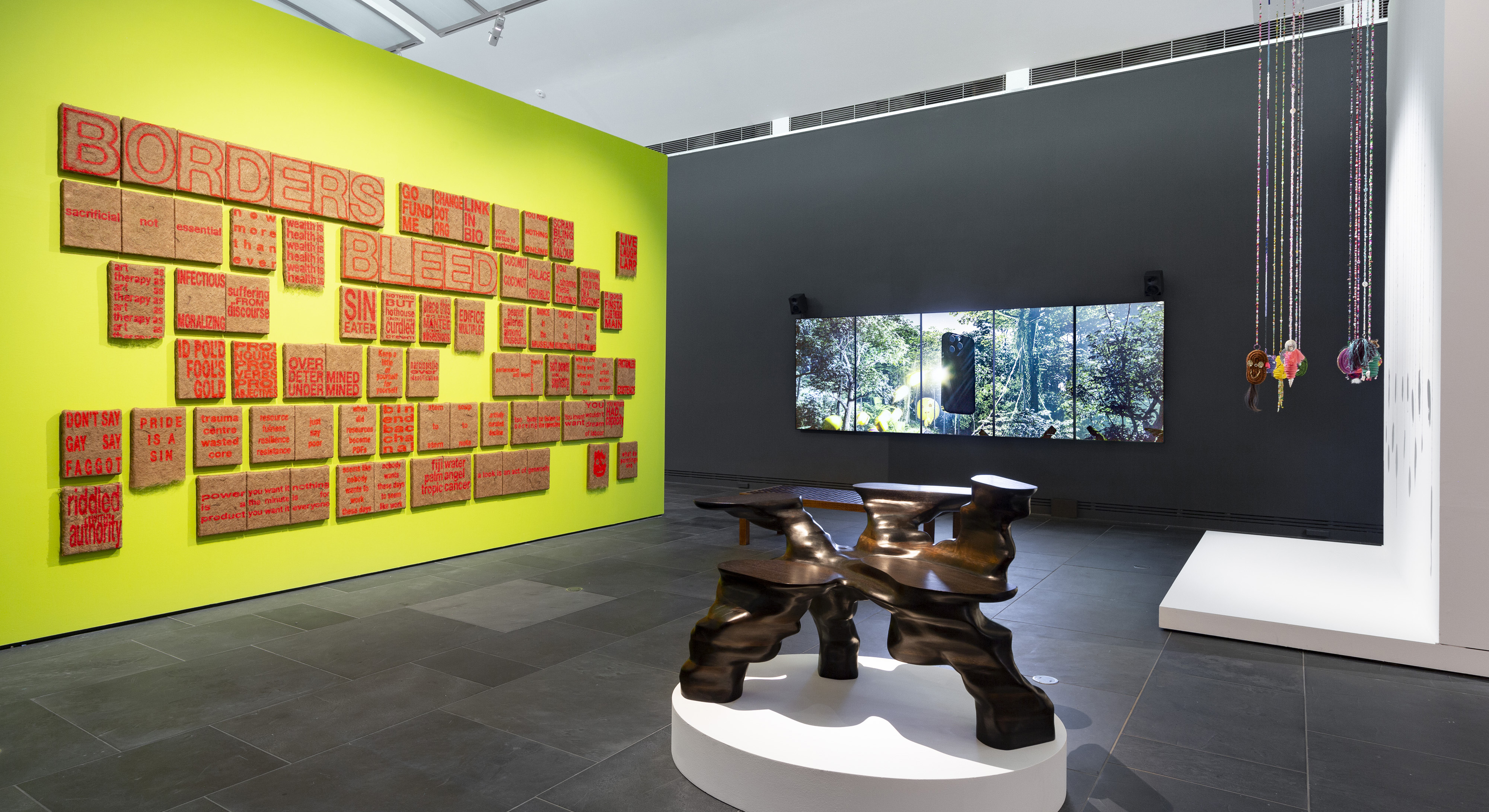 Several installations displayed in an art gallery.