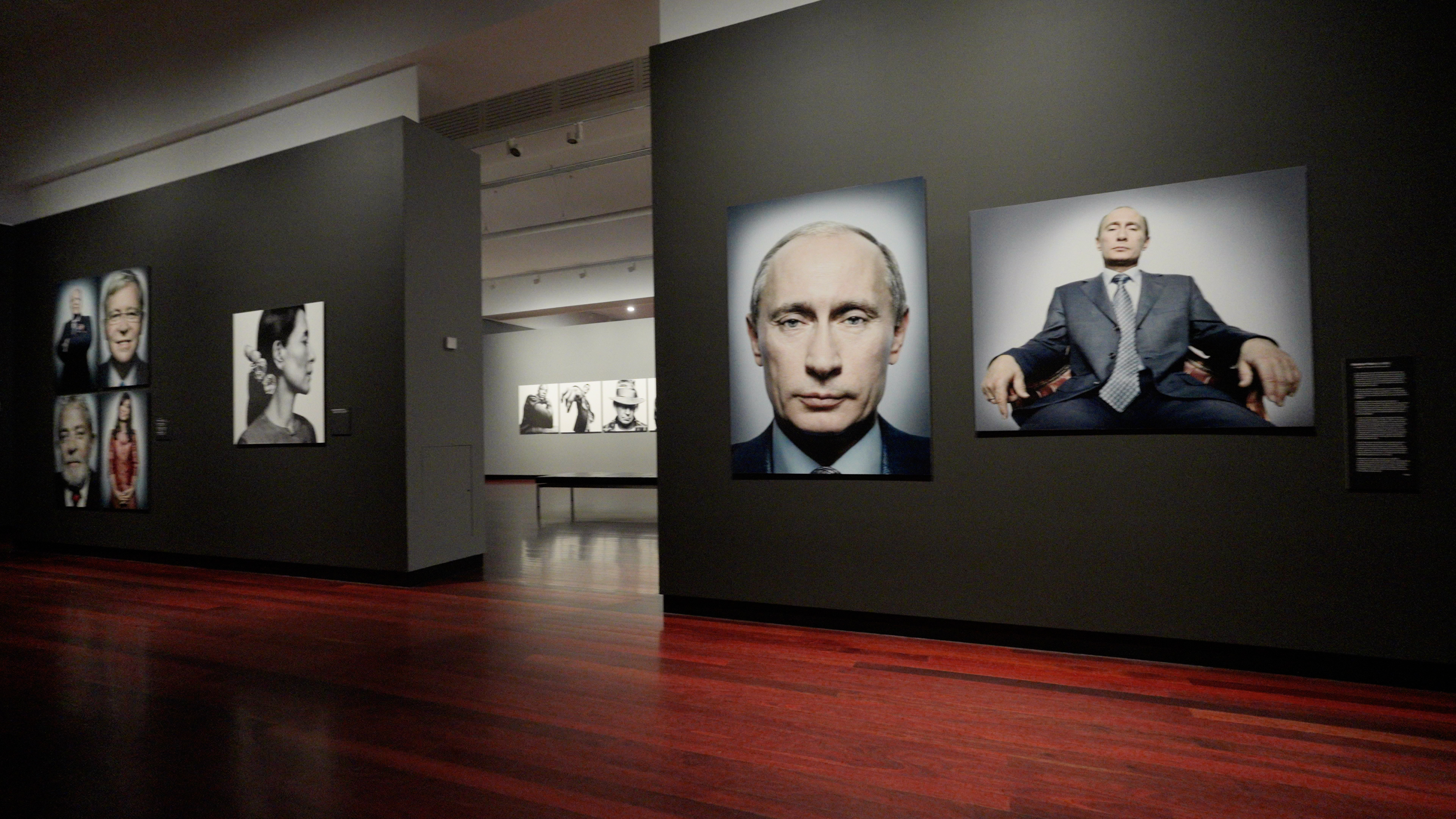 An exhibition with portrait photographs of public figures, including Vladimir Putin and Neil Young.