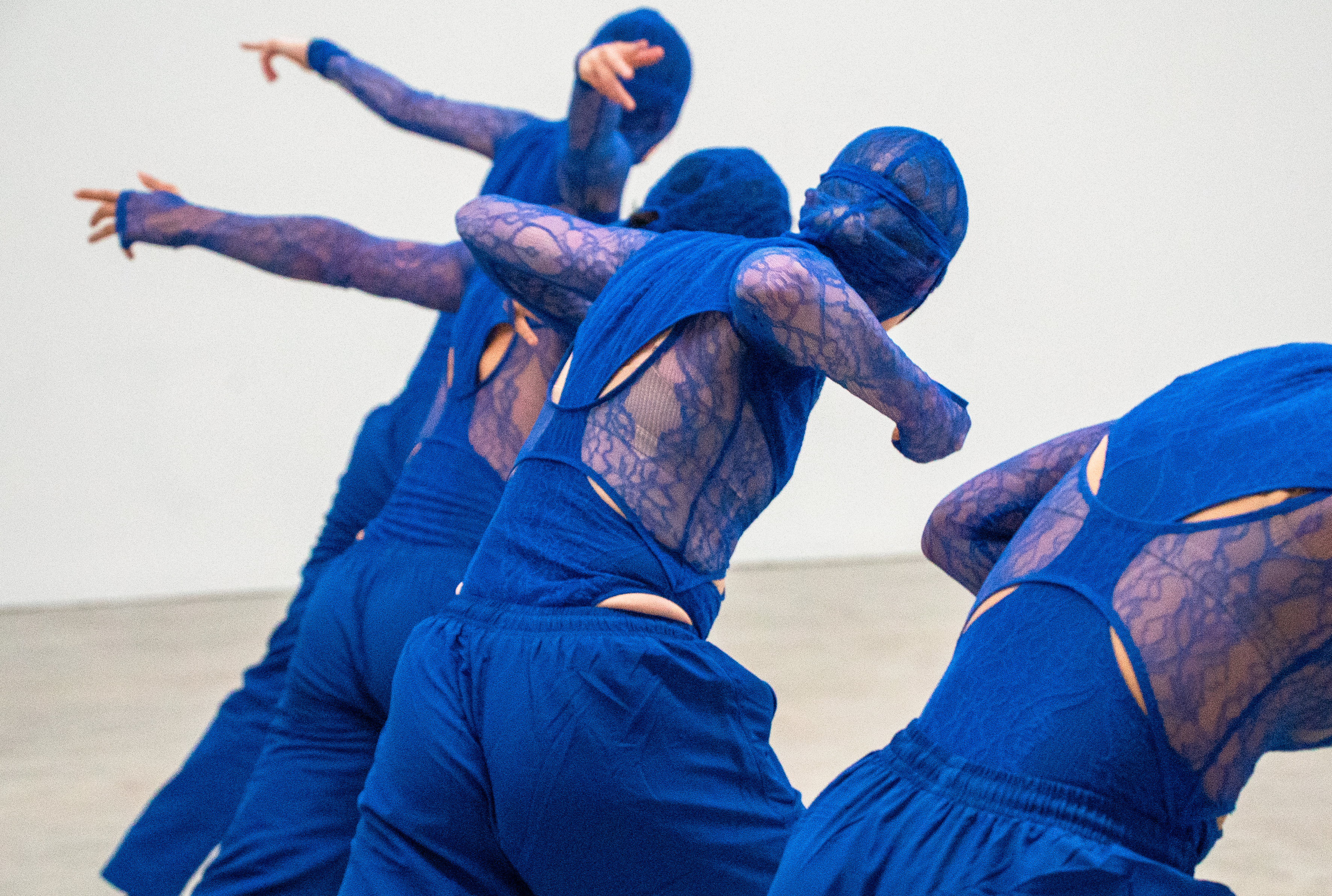 Dancers in blue outfits.