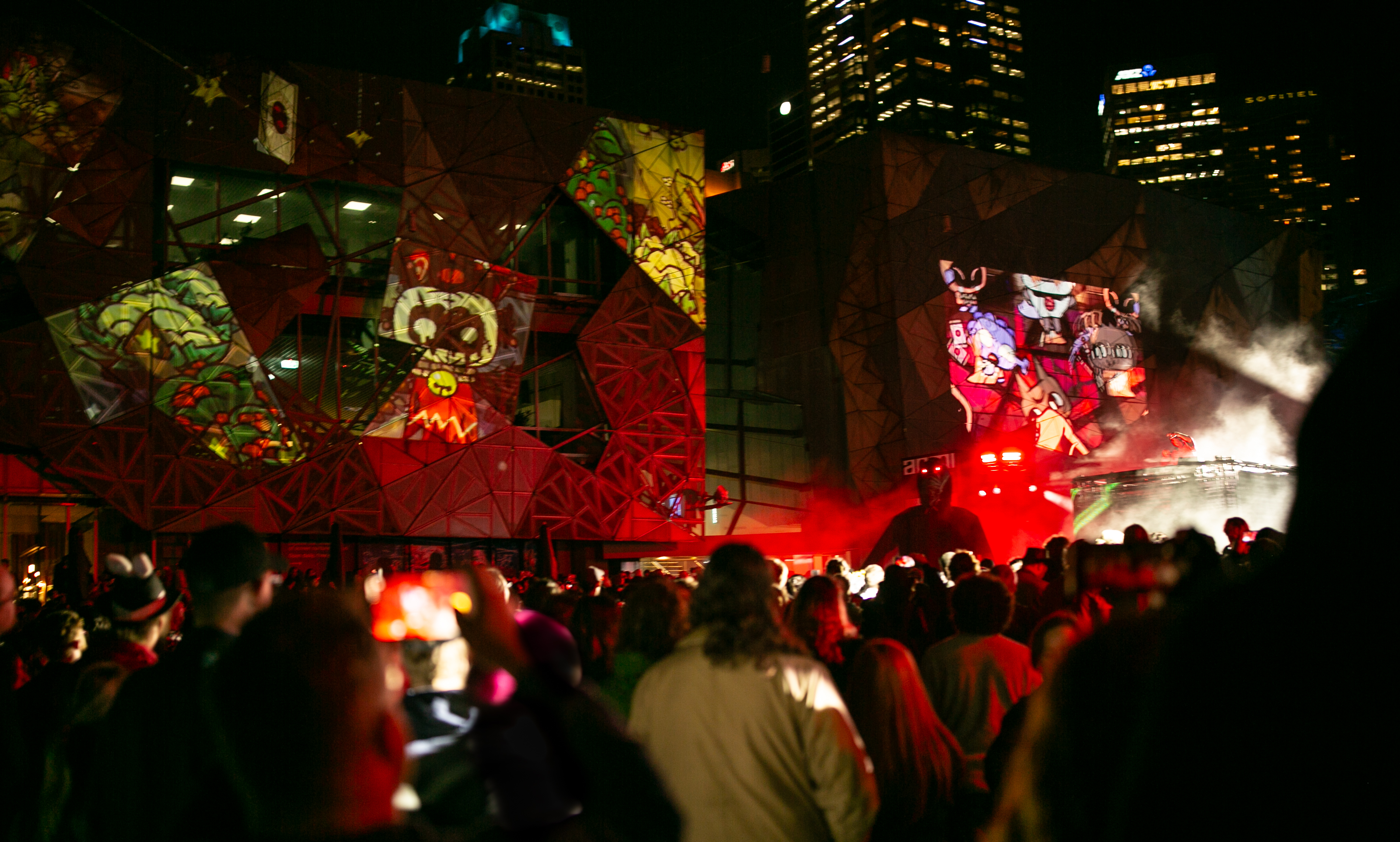 A crowd gathers in Federation Square.