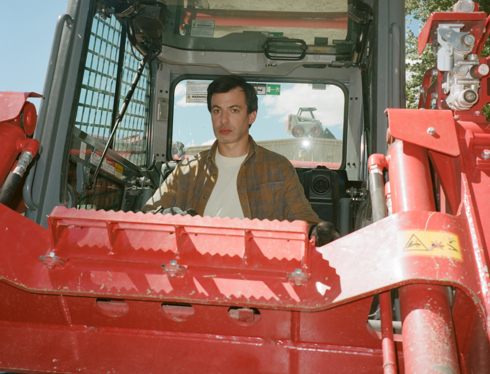 A man sitting in a tractor 