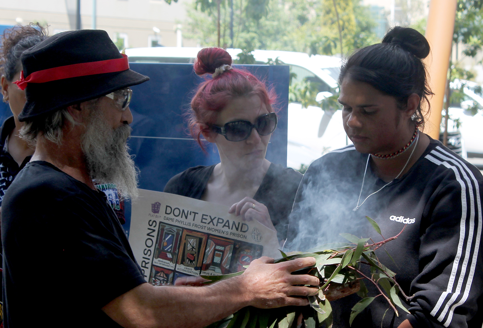 Mourners stage a vigil outside Melbourne’s Coroner’s Court.