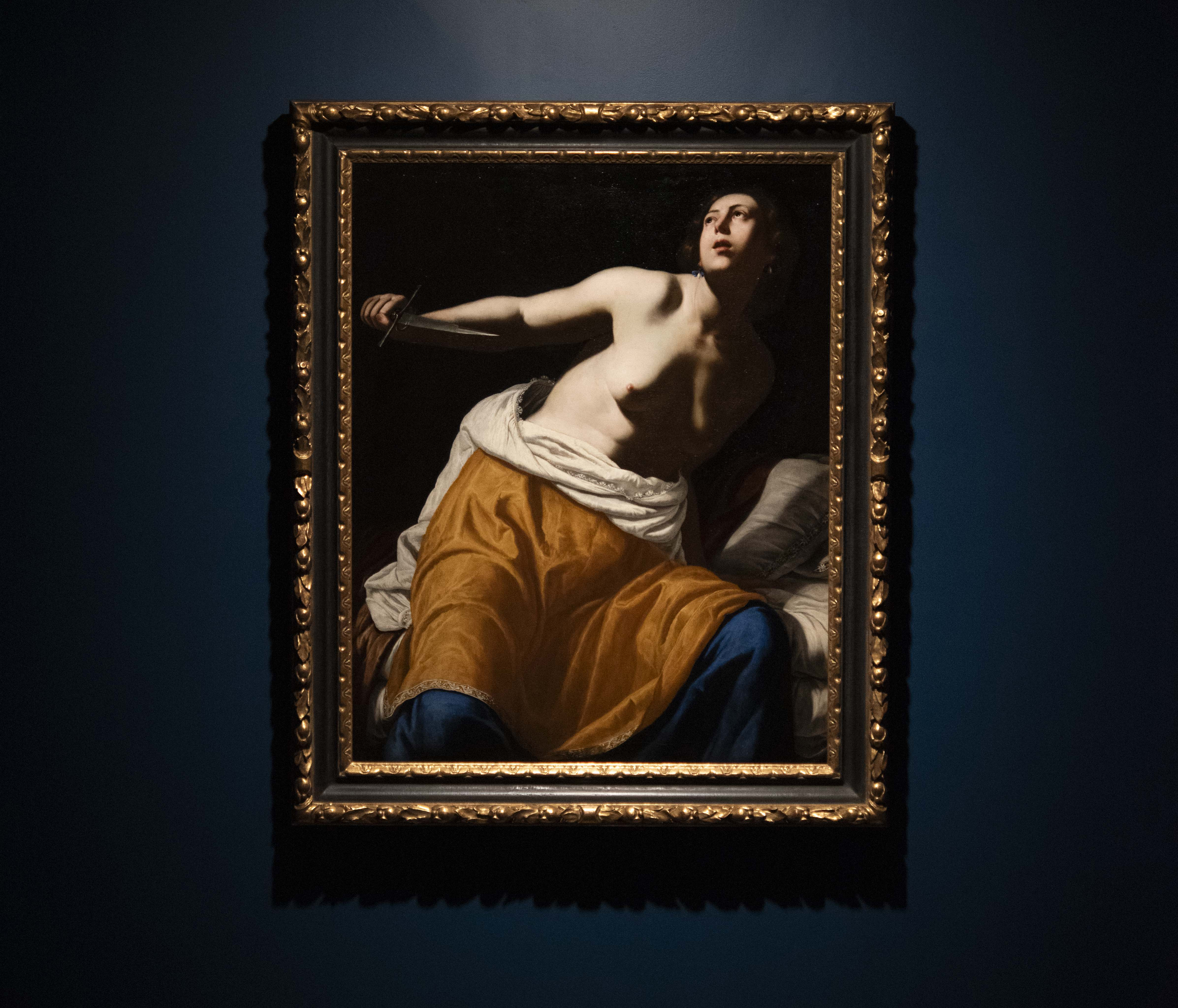 A painting of a half-naked woman with a dagger in my hand.