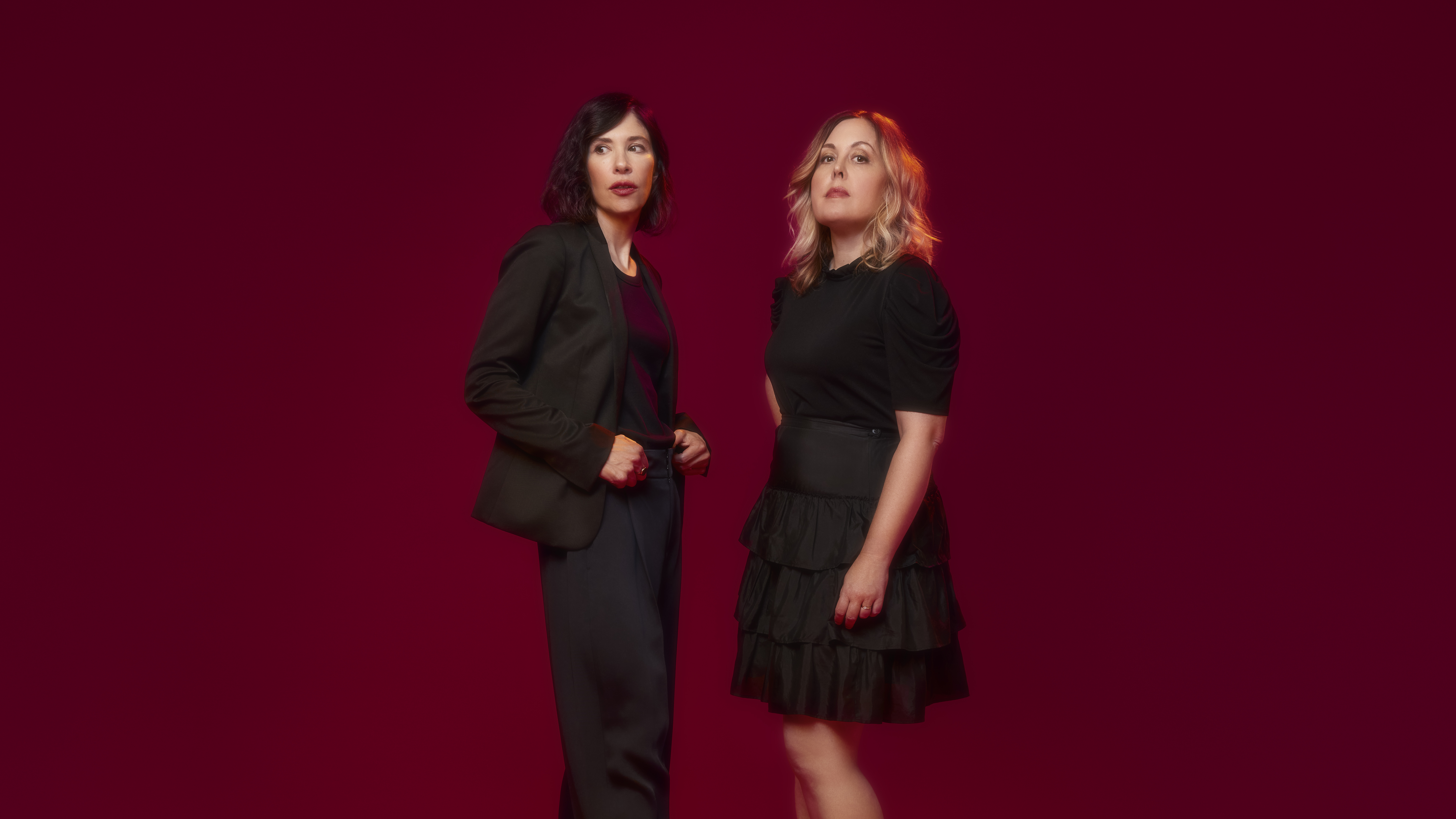 Two women in black clothing.