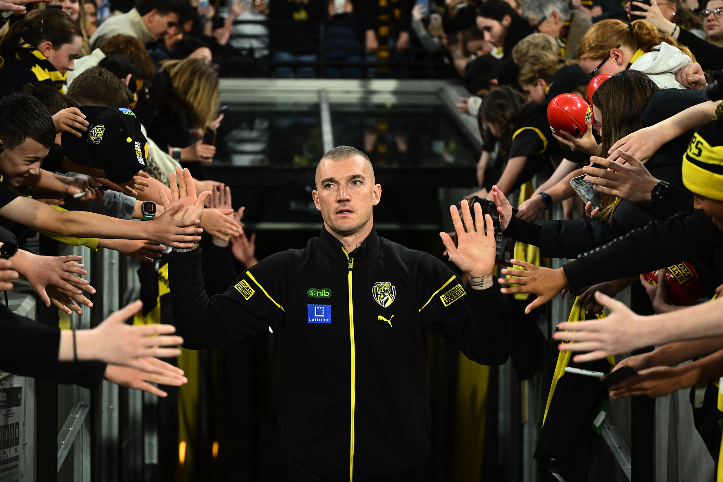 Dustin Martin greets fans at the MCG.