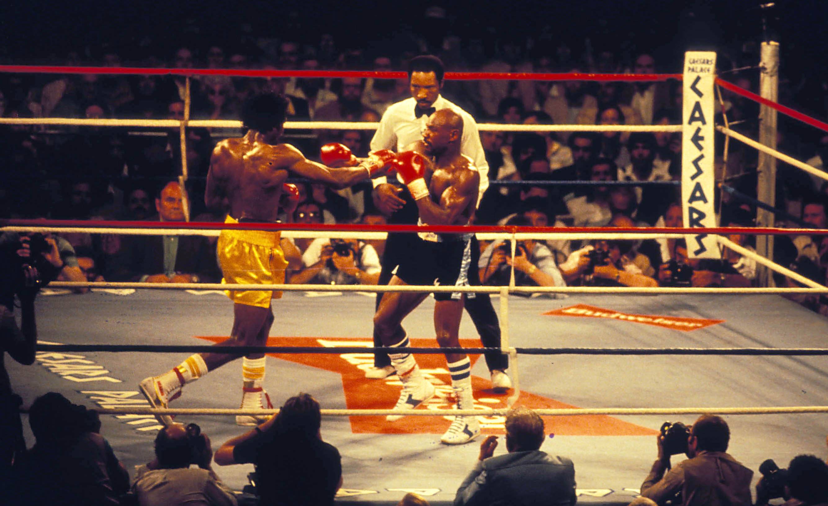 Tommy Hearns and Marvin Hagler fighting in the ring.