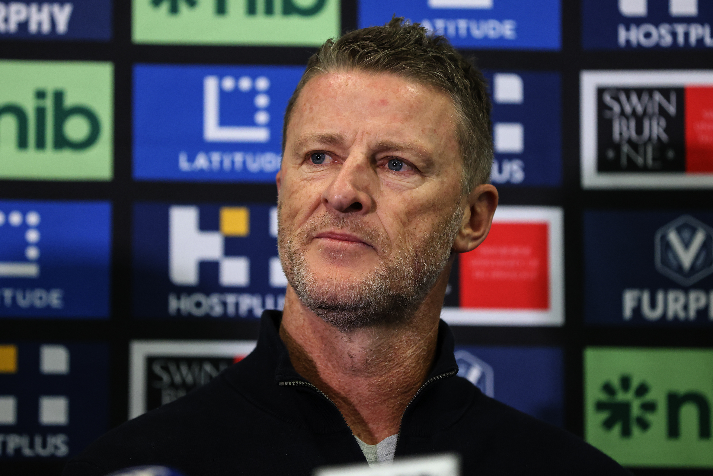 Damien Hardwick interviewed at a press conference.
