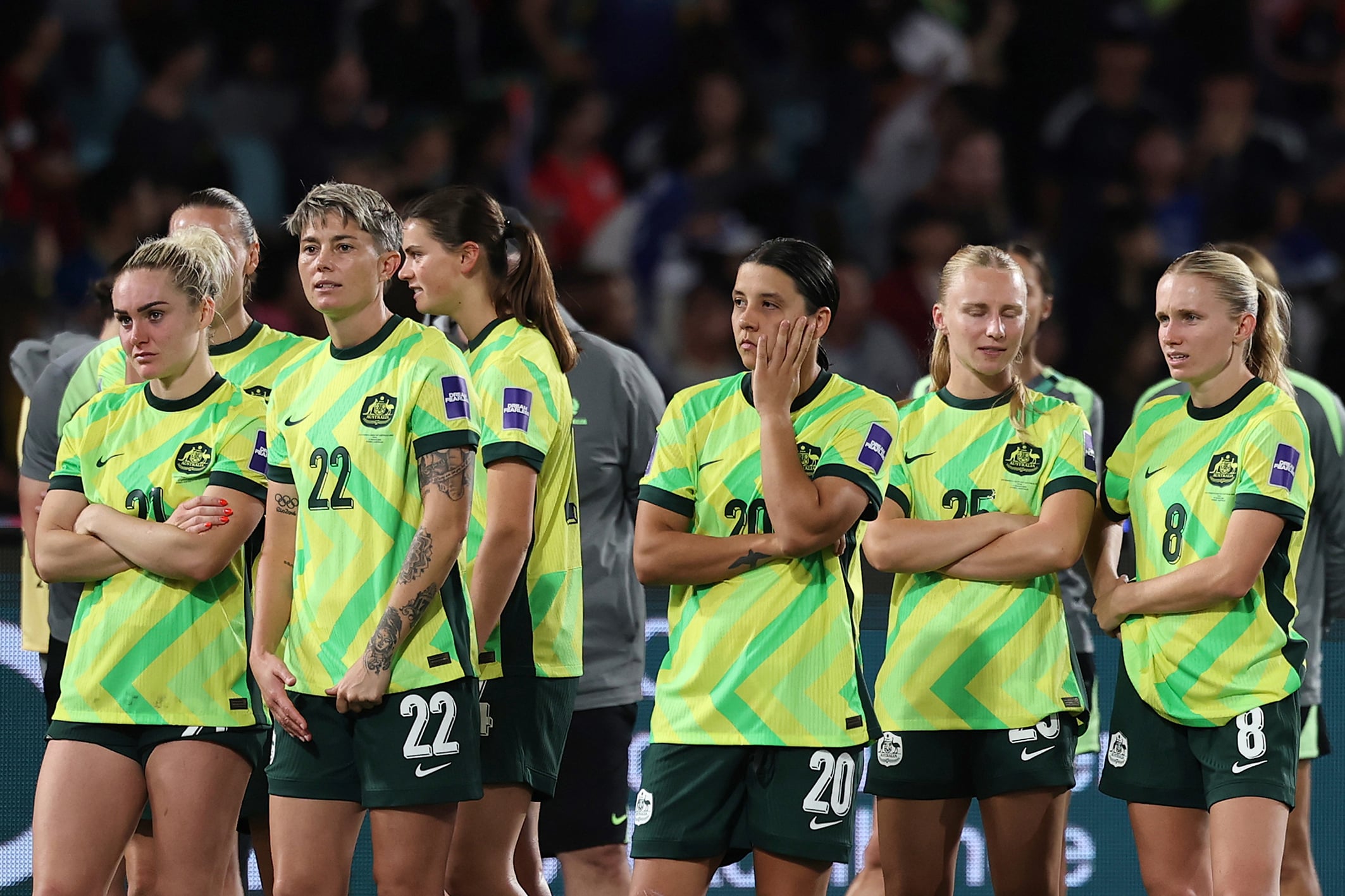 Captain Sam Kerr and her dejected Matildas after the Asian Cup final.