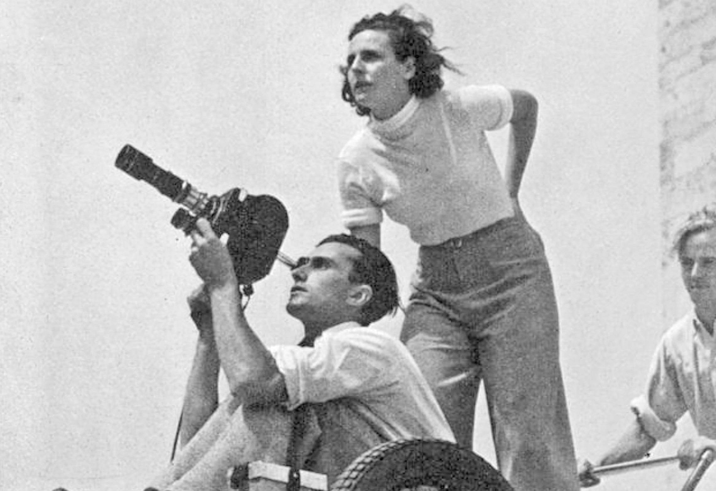 Leni Riefenstahl on the camera dolly during the filming of Olympia