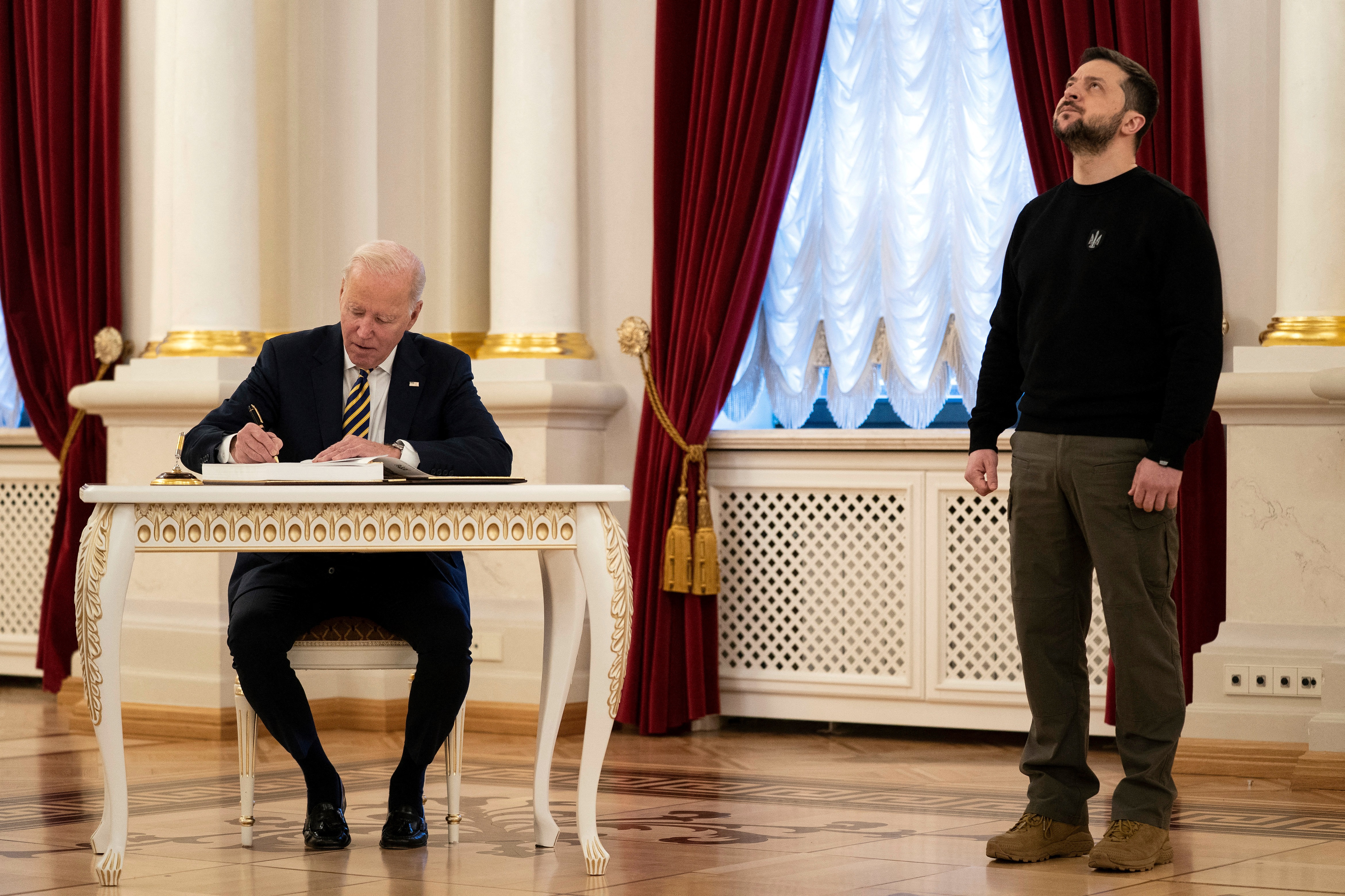Biden visits Kyiv as Putin withdraws from arms treaty