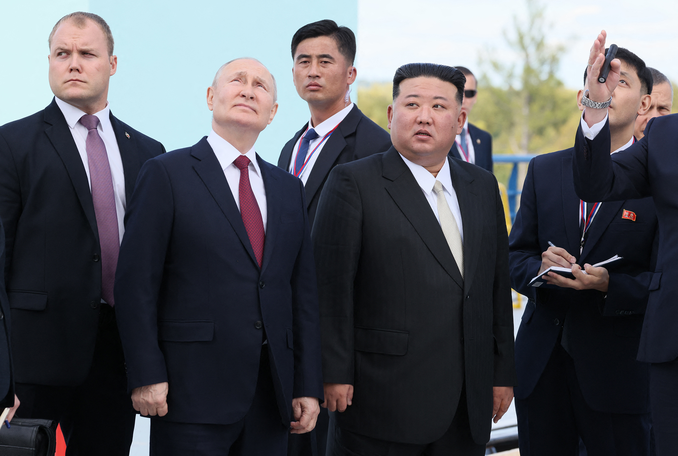 Russia’s President Vladimir Putin and North Korean leader Kim Jong-un surrounded by bodyguards.