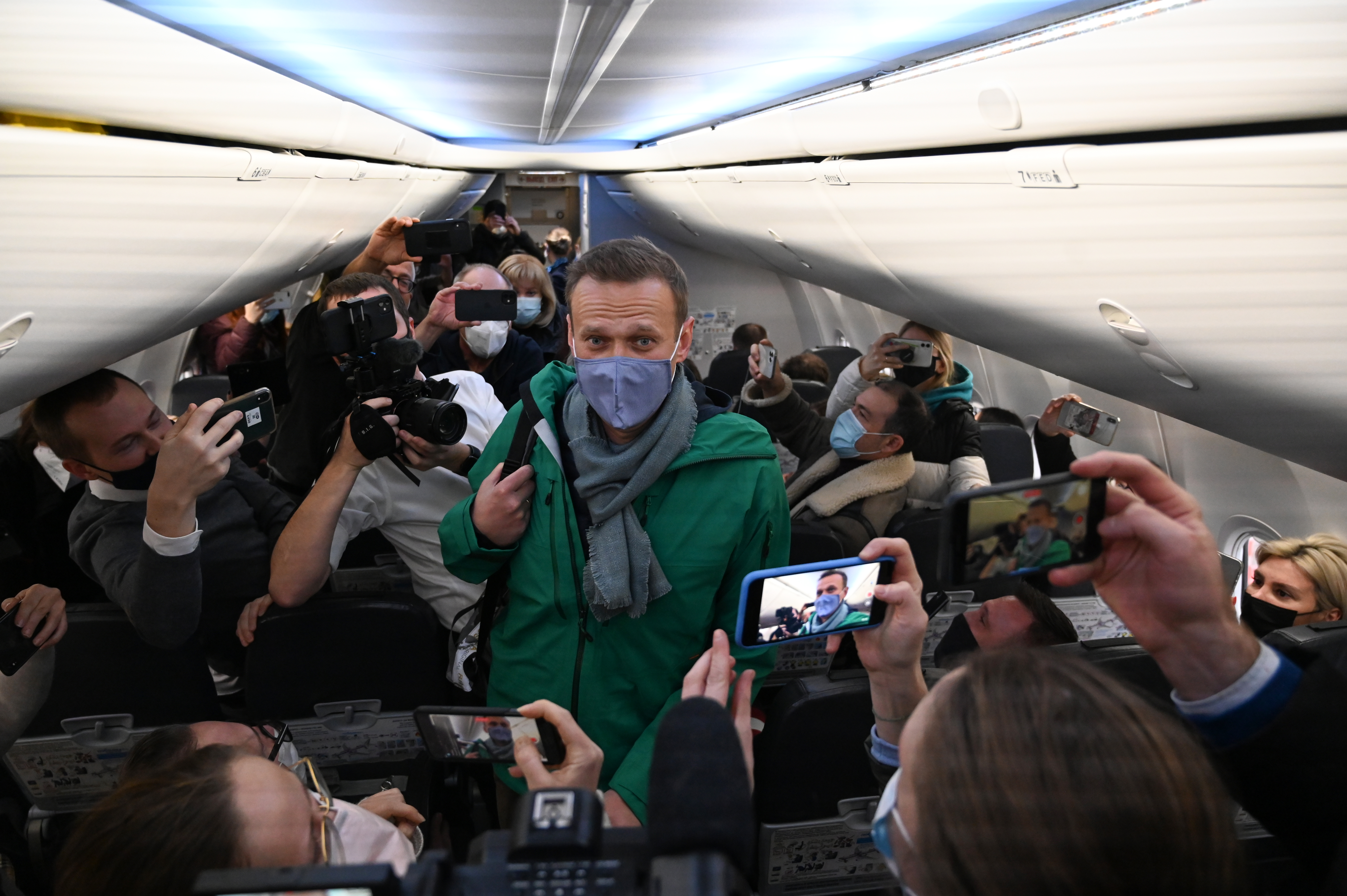 Putin rival lands back in Moscow and back in jail