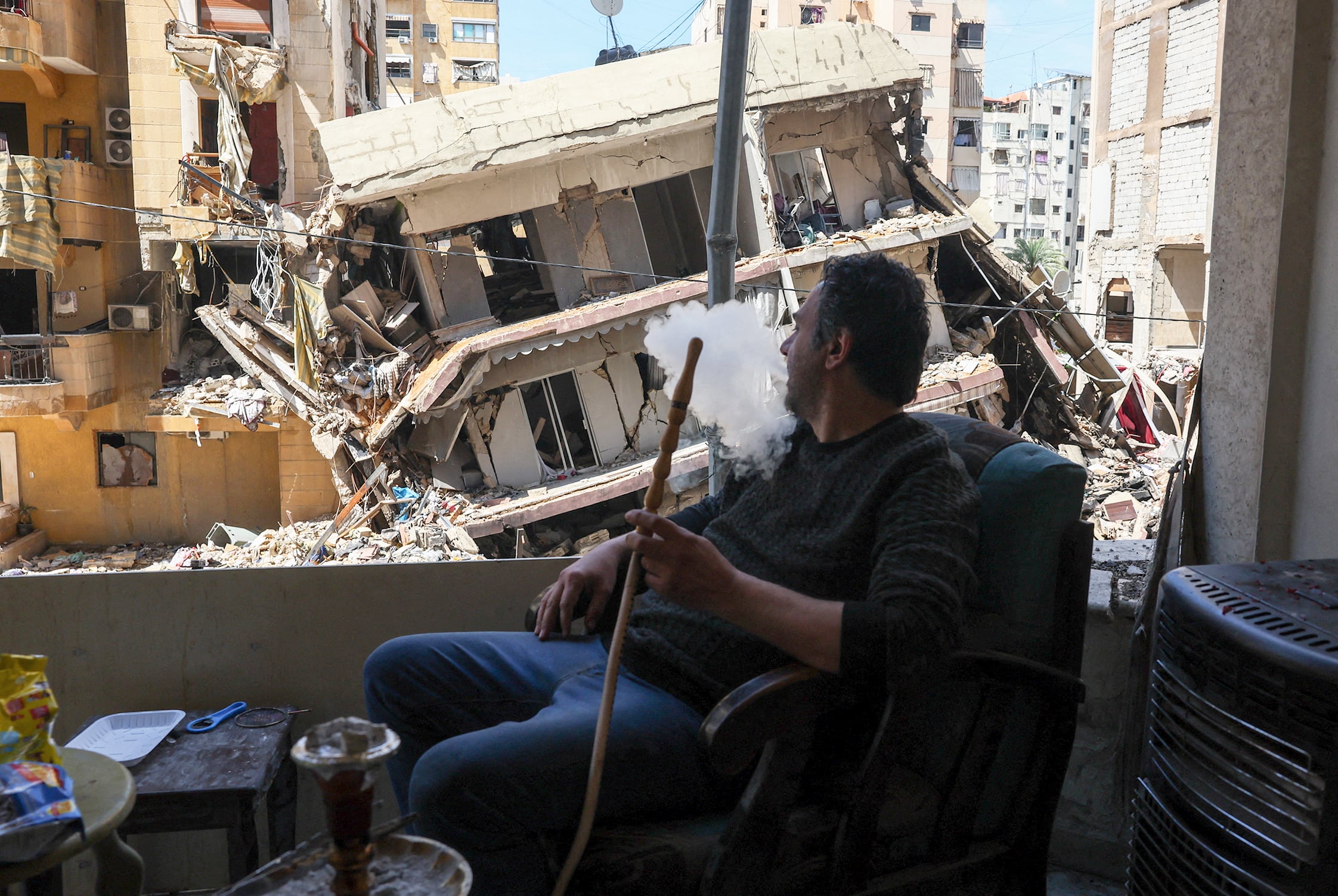 A man surveys the damage of an Israeli strike on southern Beirut.