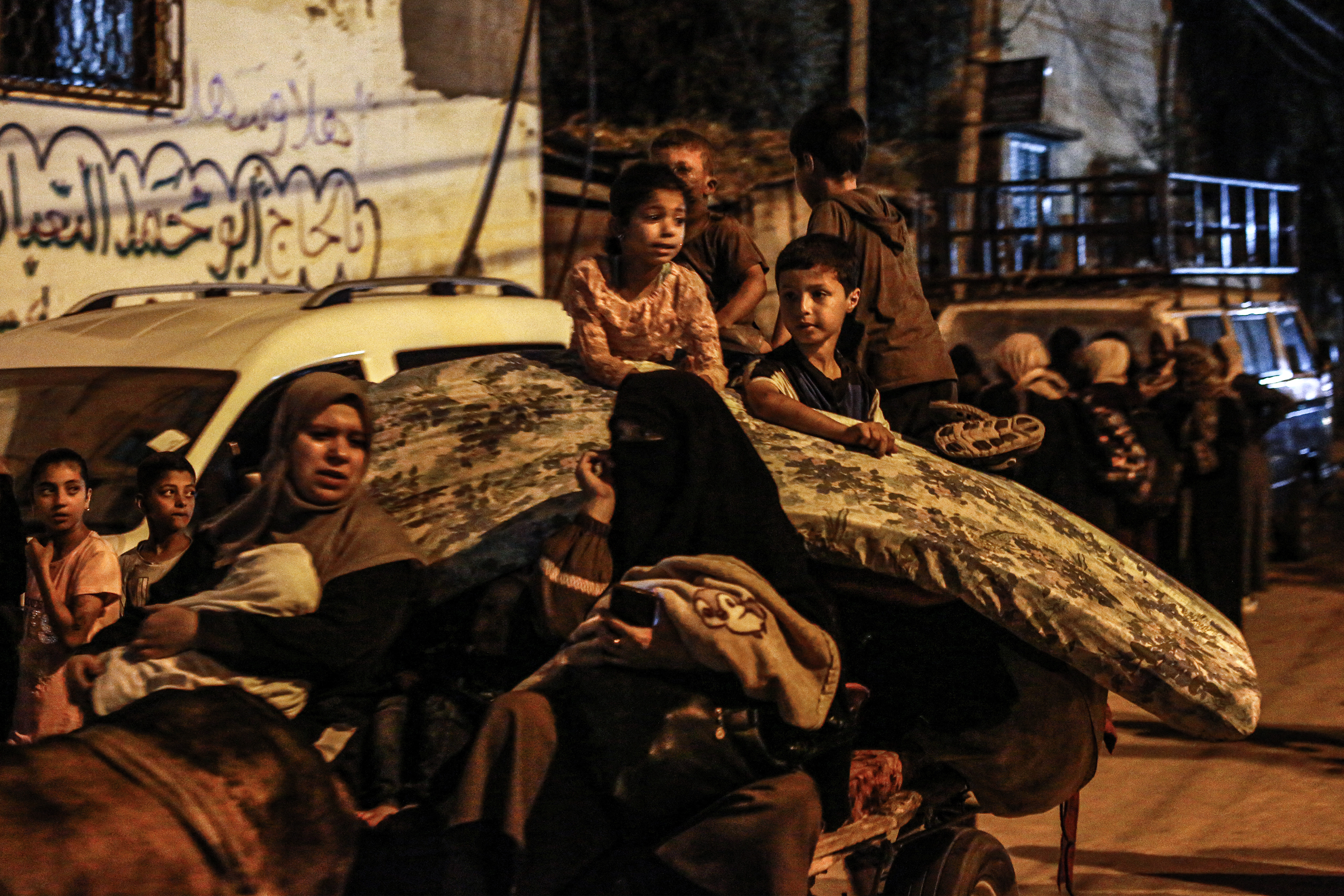 Displaced families flee from the east of Bureij in central Gaza. 