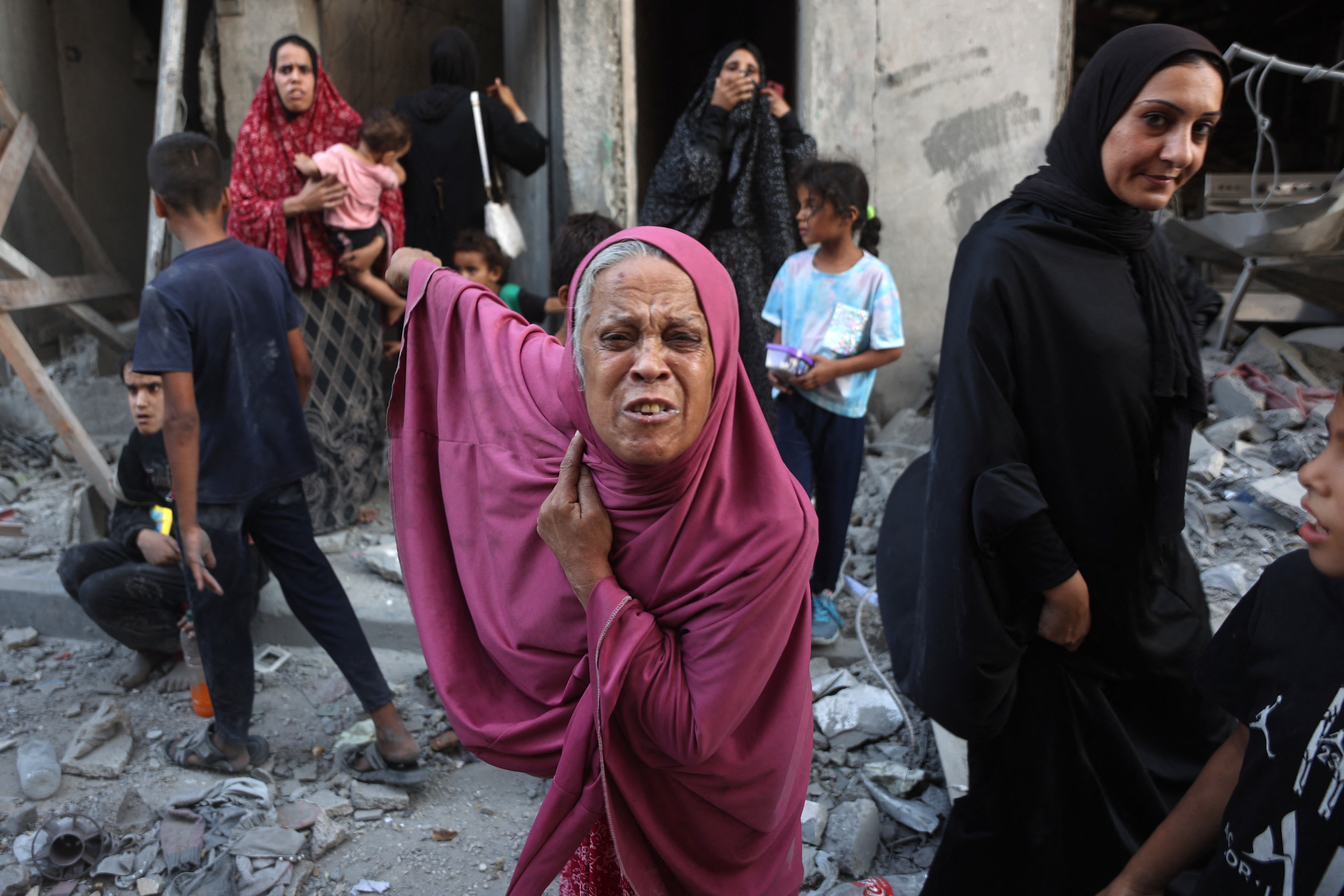 Palestinians among the rubble in Gaza City’s Sheikh Radwan neighbourhood after an Israeli bombardment on August 11. 